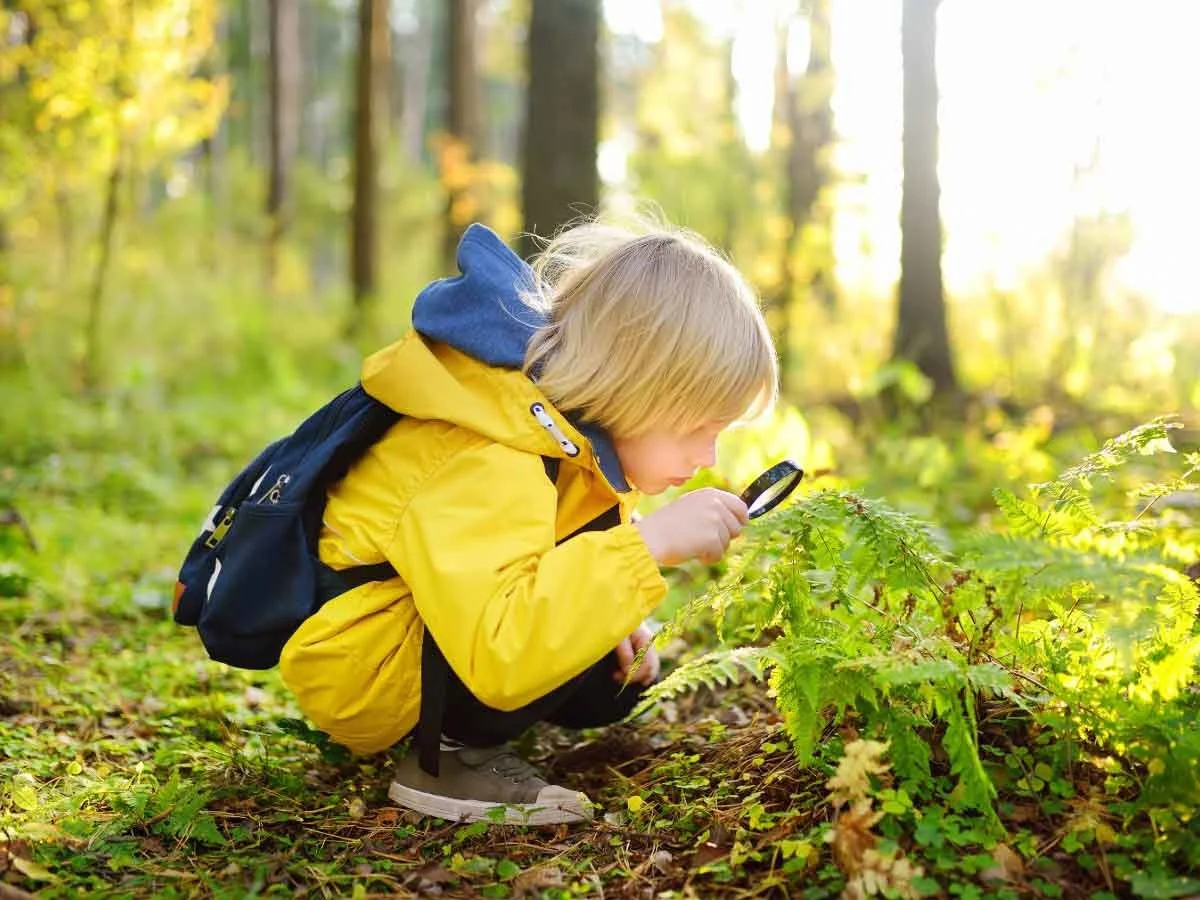 Young boy with a magnifying glass