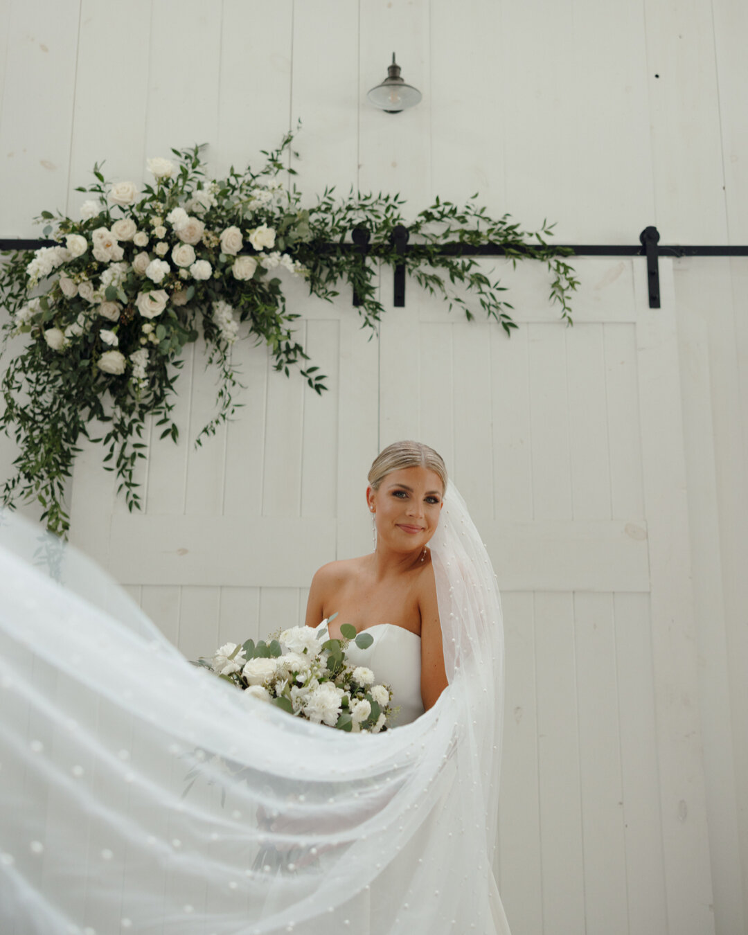 Mary Tod's pearl veil and these florals were so romantic and dreamy! ​​​​​​​​
​​​​​​​​
When we design white and green bouquets and arrangements, we love adding a variety of flowers and greenery to add texture and dimension while still keeping that cl