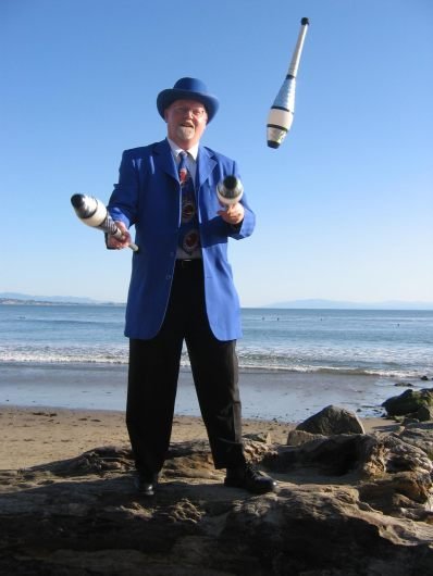 blue_suit_beach_juggle.jpeg