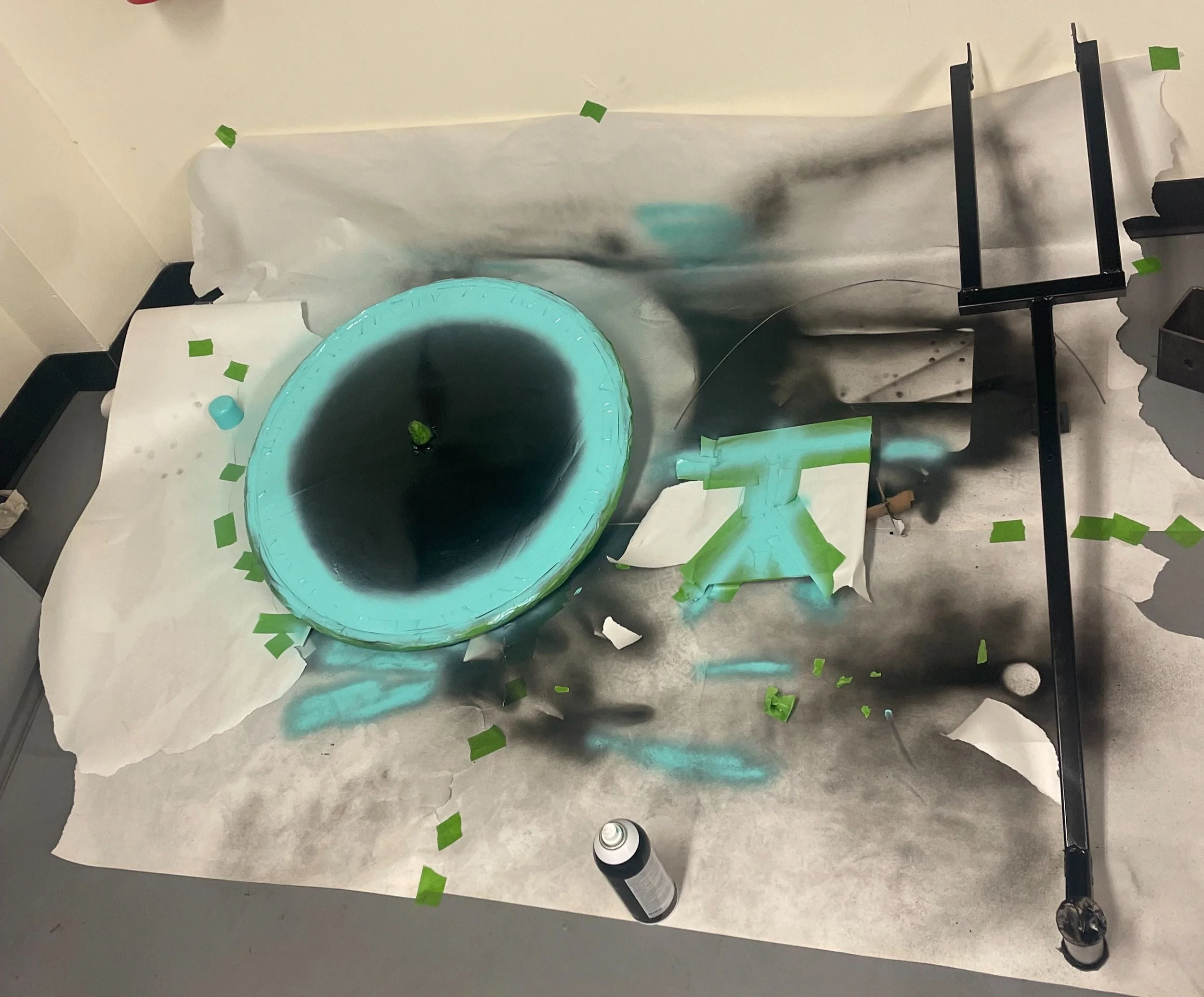 The bike disassembled being painted themed as the Tron Bike