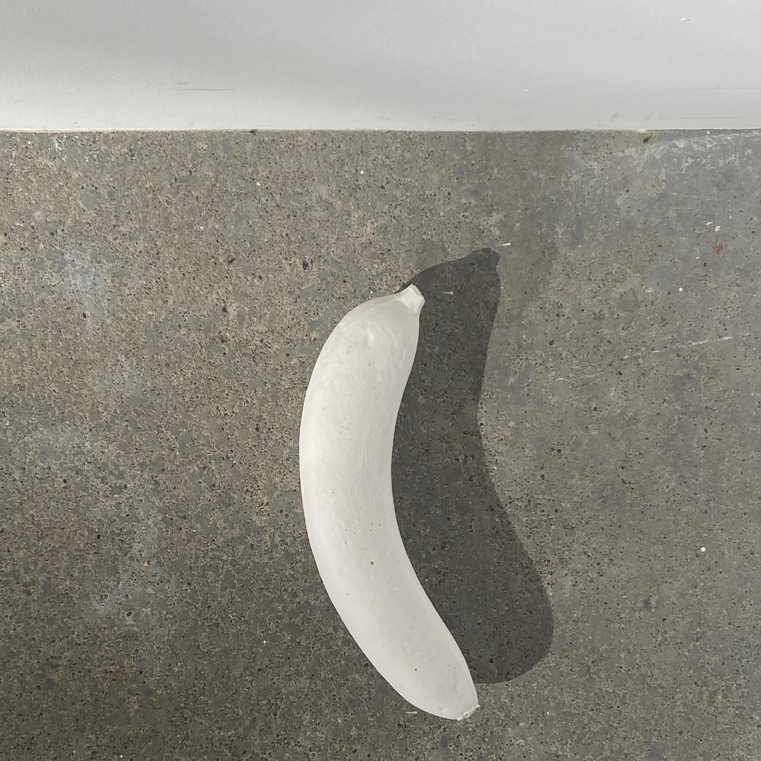Shadow play on concrete #bananadramas #casting #banana #abstractphotography
