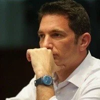 Image showing Jonathan Lowet, a man with dark hair, contemplating deeply.