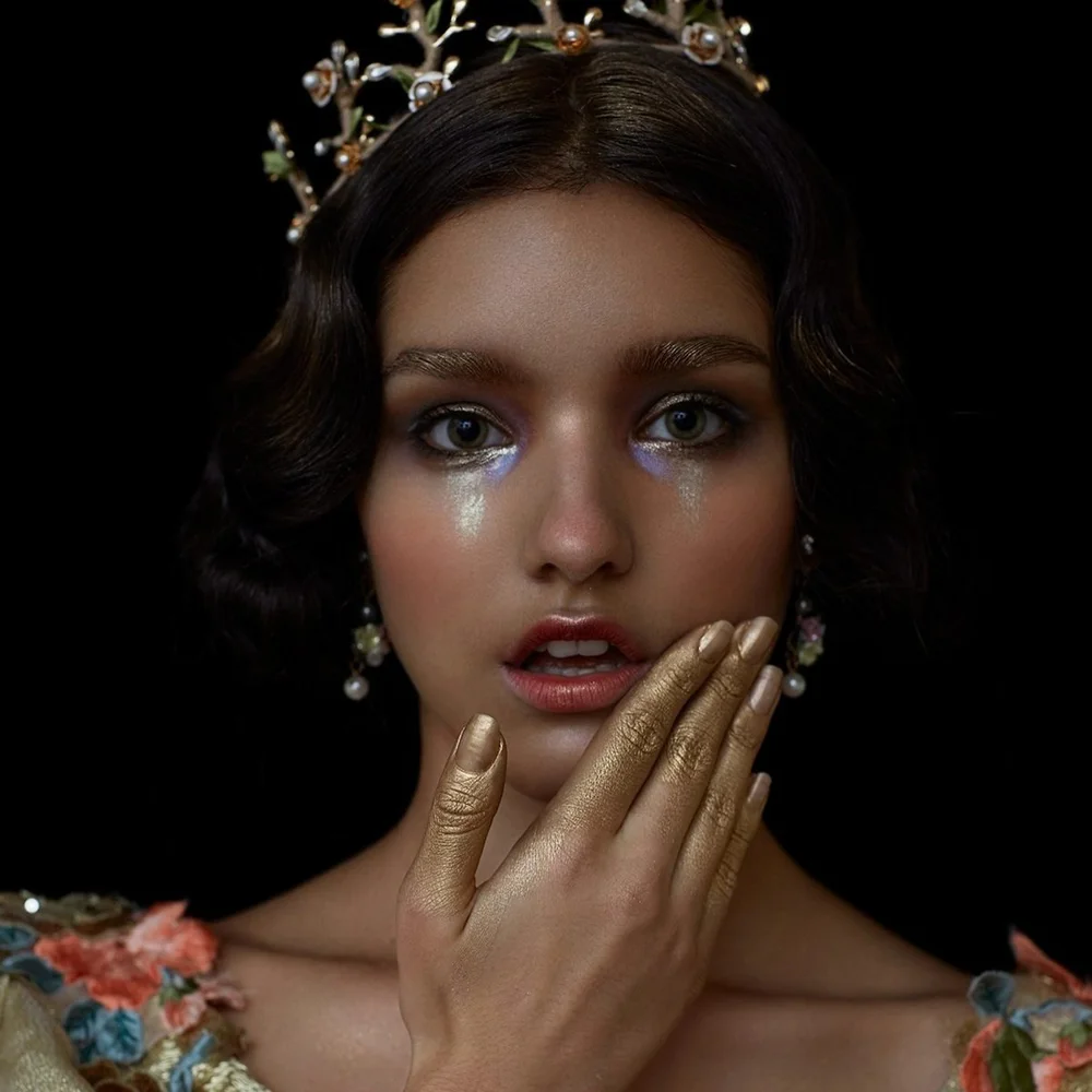 Editorial gold fashion portrait