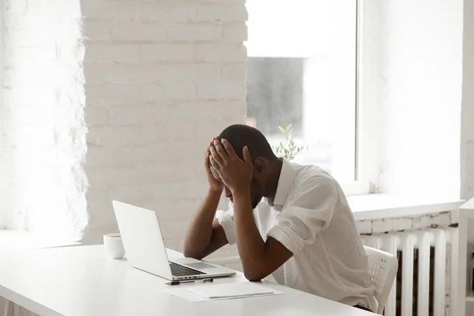 man frustrated at computer