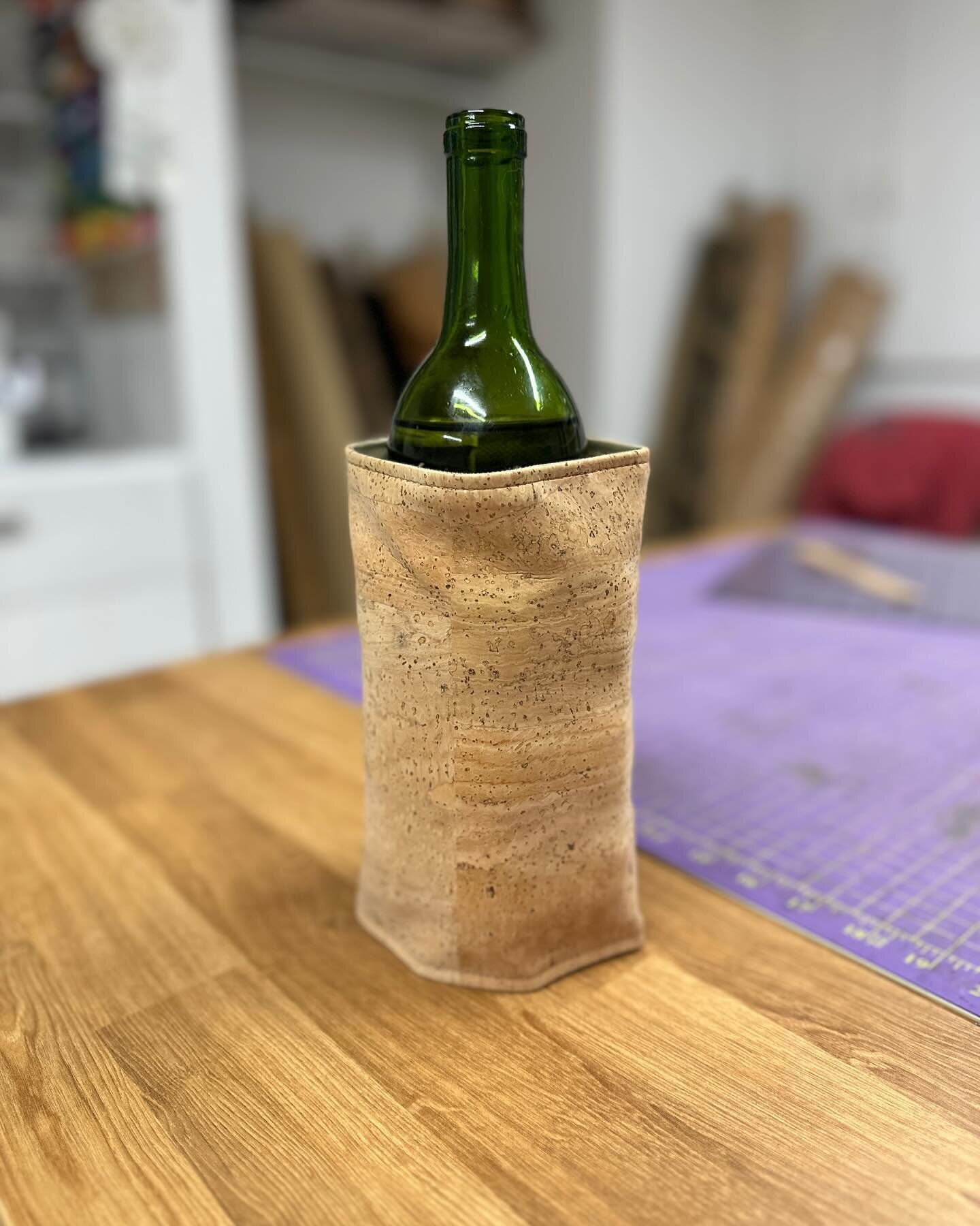 A quick photo from my studio of this fun new addition to my spring line up!  The cork wine chiller wrap.  These will be available soon. I may add some embroidery to a few🤔. #winechiller #winewrap #corkfabric #waterproofcanvas