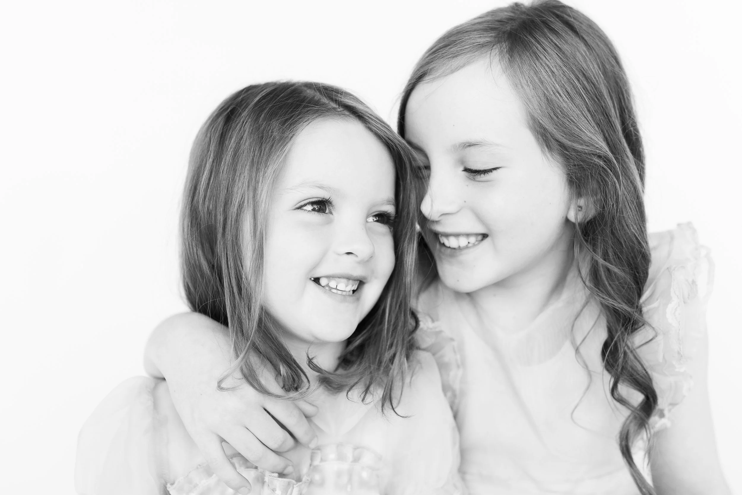 Black and White personality photography sessions for sisters and siblings in Oklahoma that capture special moments to last forever.