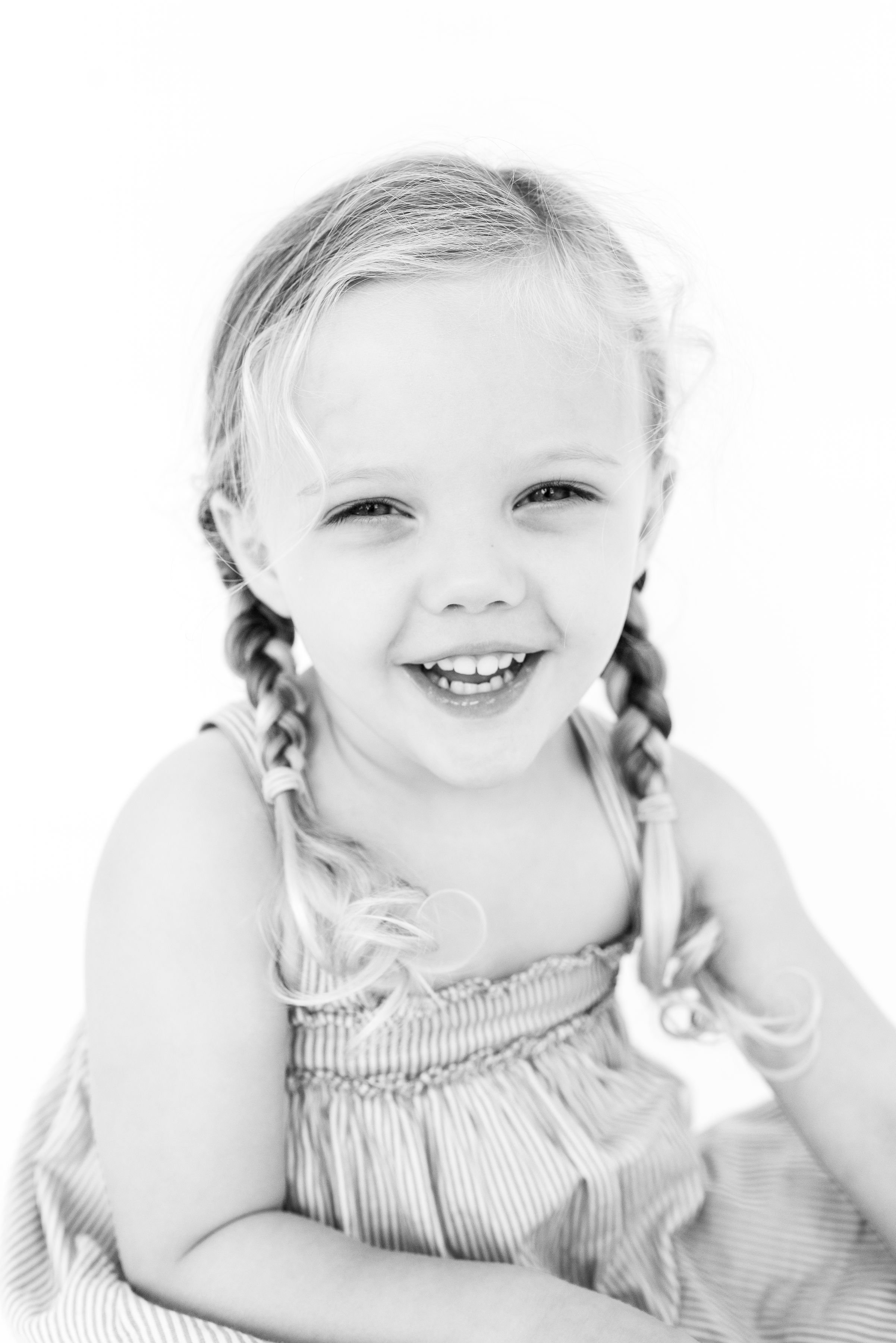 Sweet and joyful children's studio portraiture by Kacey Gilpin in Tulsa, OK. Genuine personality portraits in the heirloom black and white style.