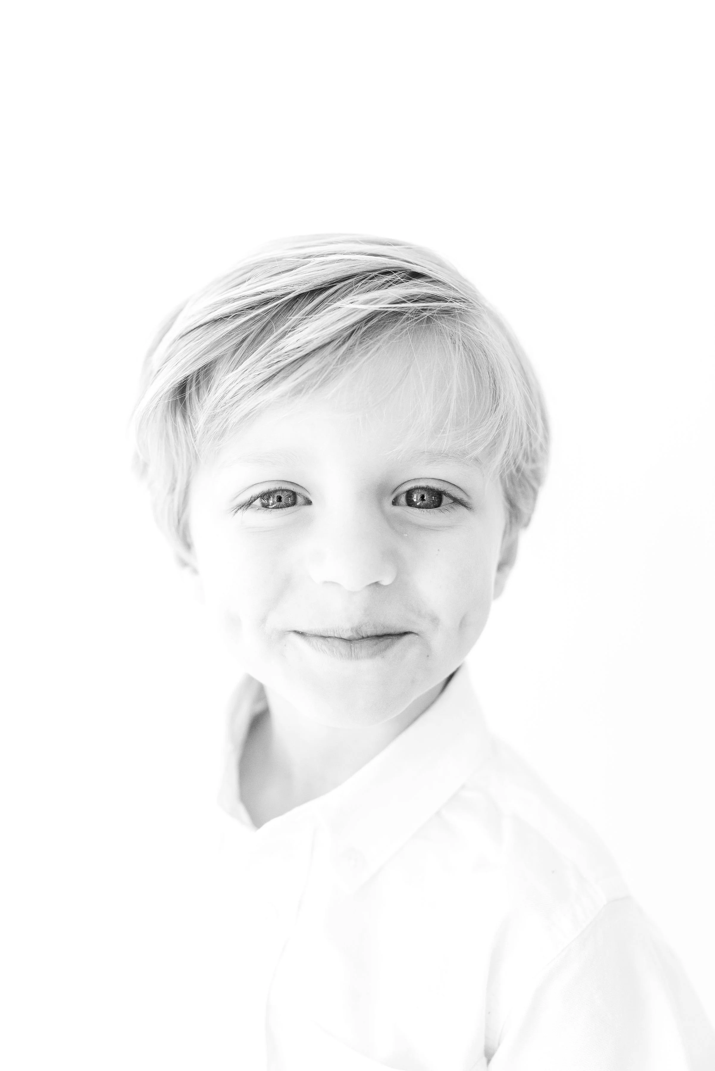 Classic black and white photo of children and families that capture genuine personality.