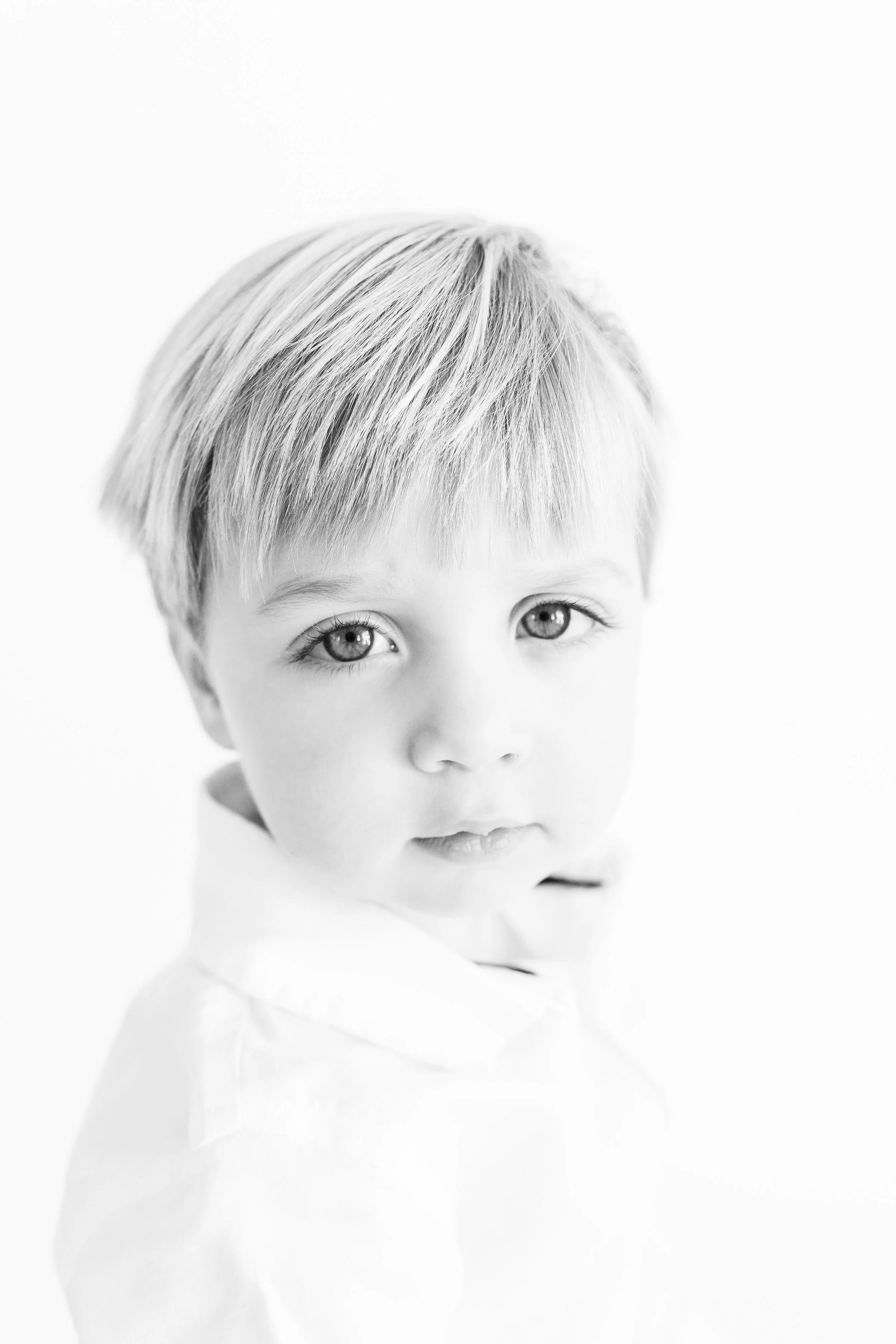 Baby's first studio photography session capturing sweet features and personailty.