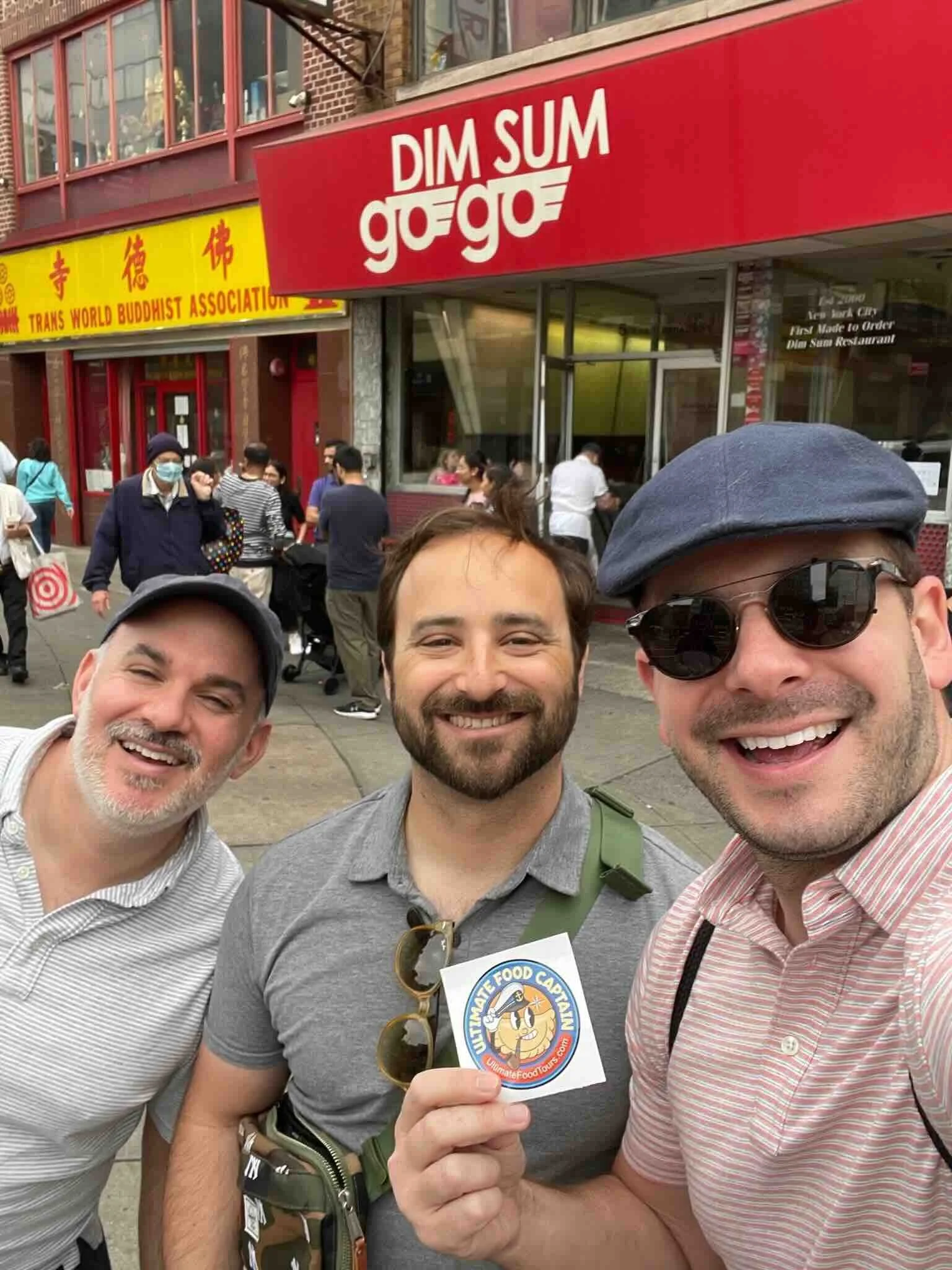 A couple with a tour guide enjoying one of the best Chinatown food tours NYC offers which is one of the most fun NYC activities for couples