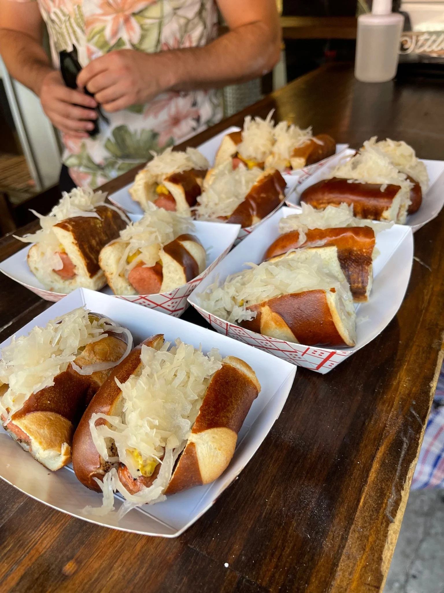 Oktoberfest Sausage heaped with Sauerkraut on Pretzel Buns