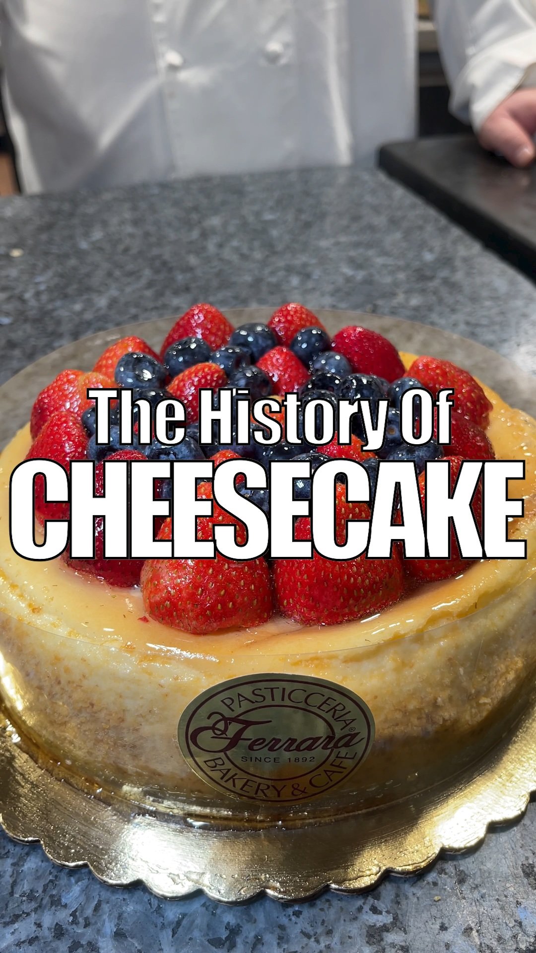 A closeup of a strawberry cheesecake at Ferrara Bakery in Little Italy on the Lower East Side of Manhattan New York City. Our guests experience this cheesecake on our soho dessert tour and on our Lower East Side Food Tour. The cream cheese filled cak