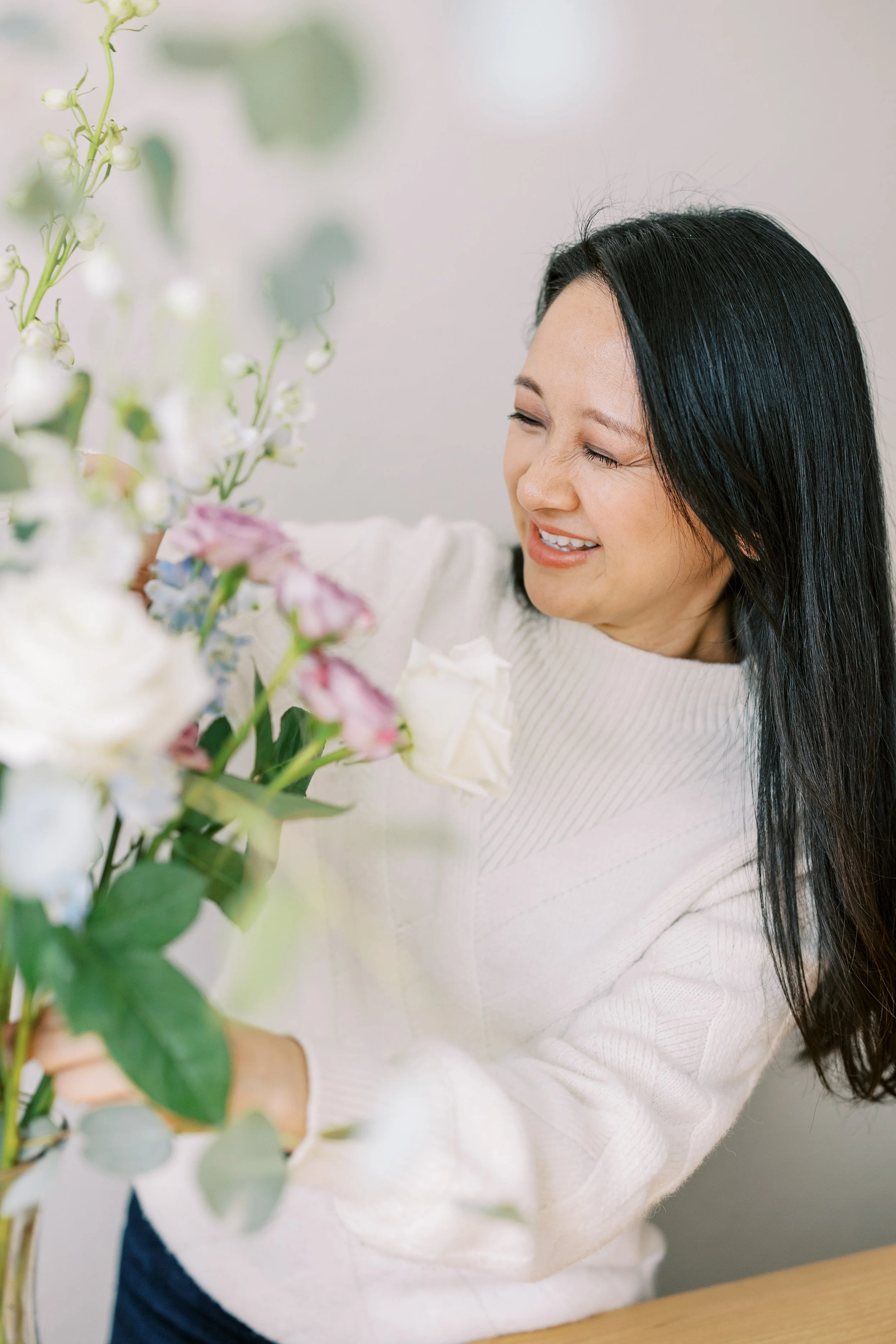 Judy of Little Little Floral Production with flowers.