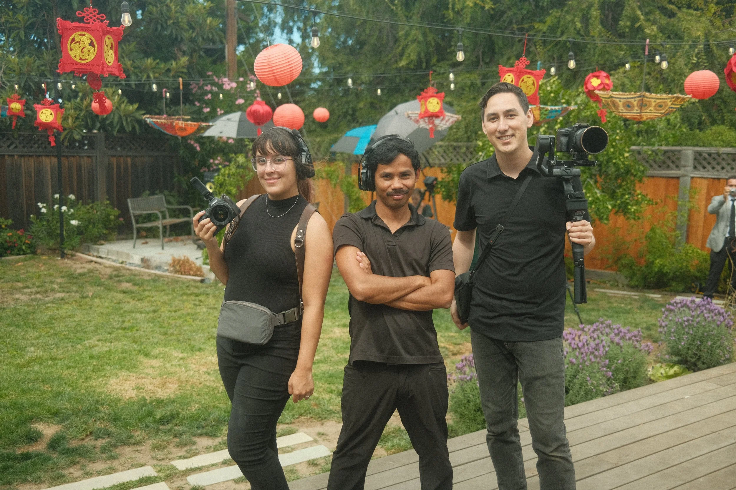San Francisco wedding videographer team Tangerine Weddings stands together in an outdoor setting.