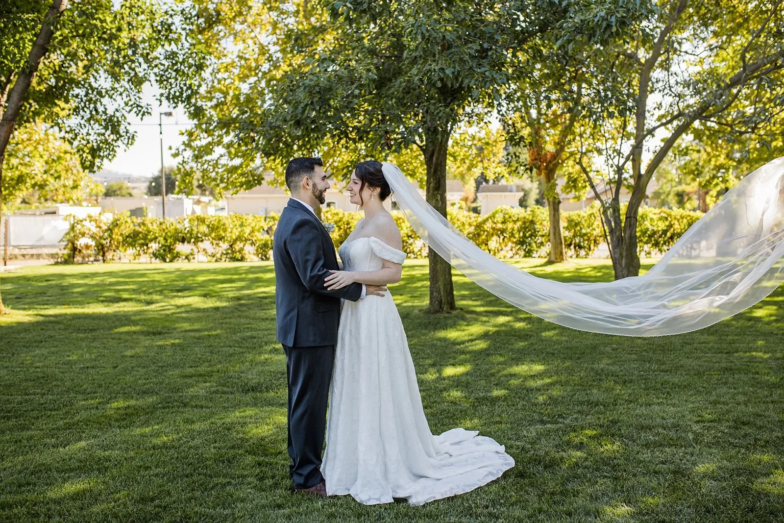 Bride and groom look at each other at a Garre Winery wedding.