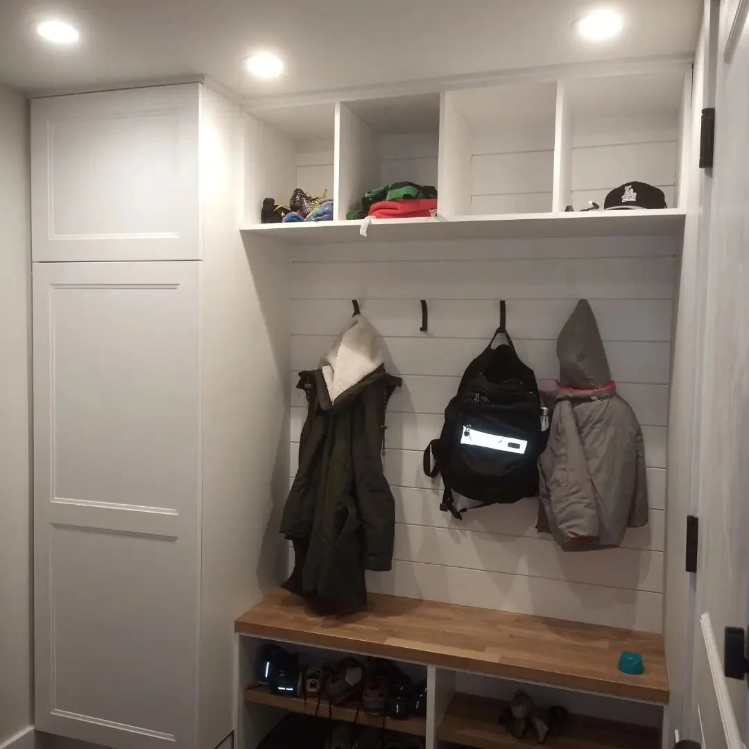 With 3 flights of stairs and 3 kids at home this young couple really need some help with laundry and storage. We helped create and laundry chute connecting all the floors directly to the laundry room in the basement and added a much needed area to st