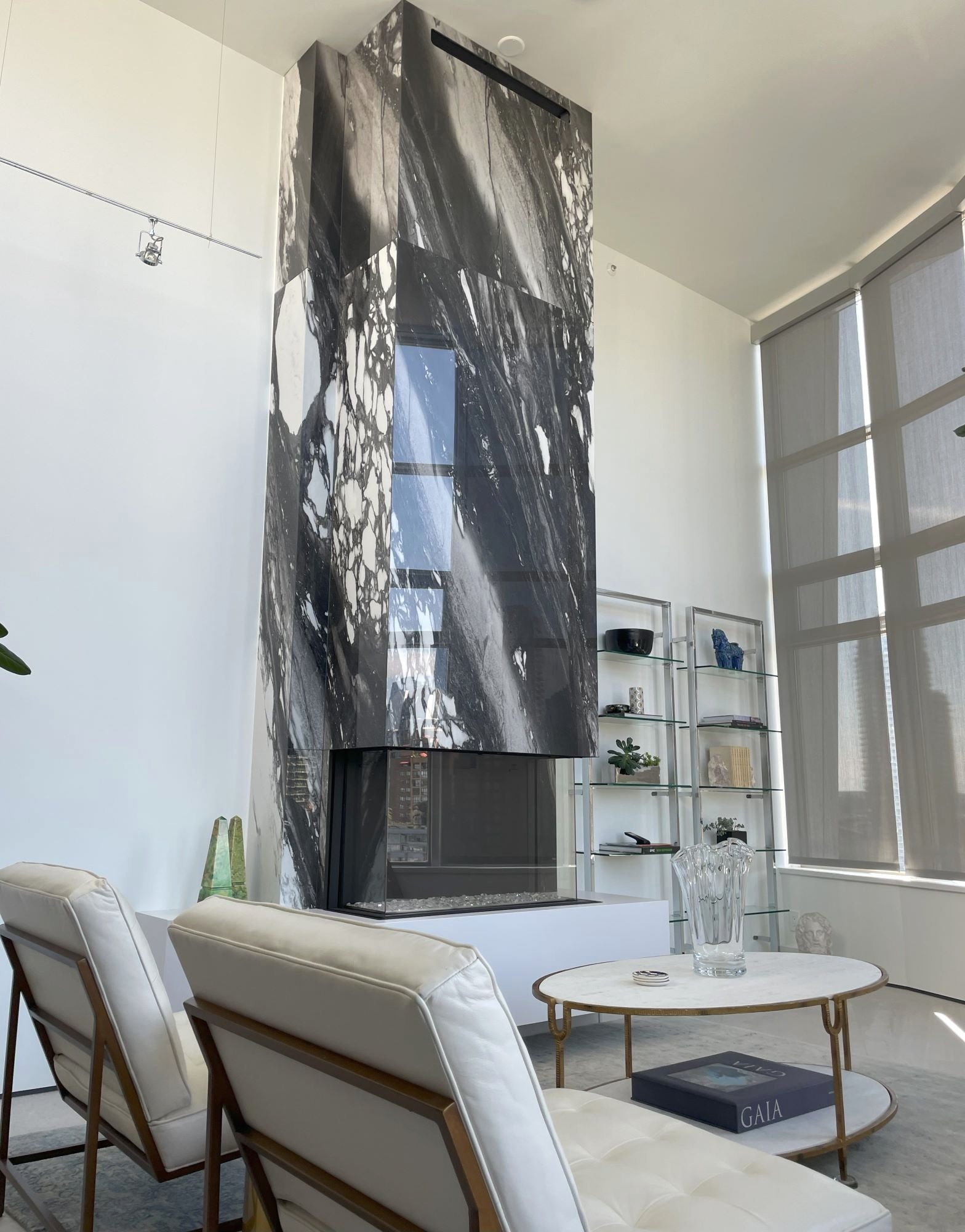 14' ceilings, porcelain wrapped fireplace