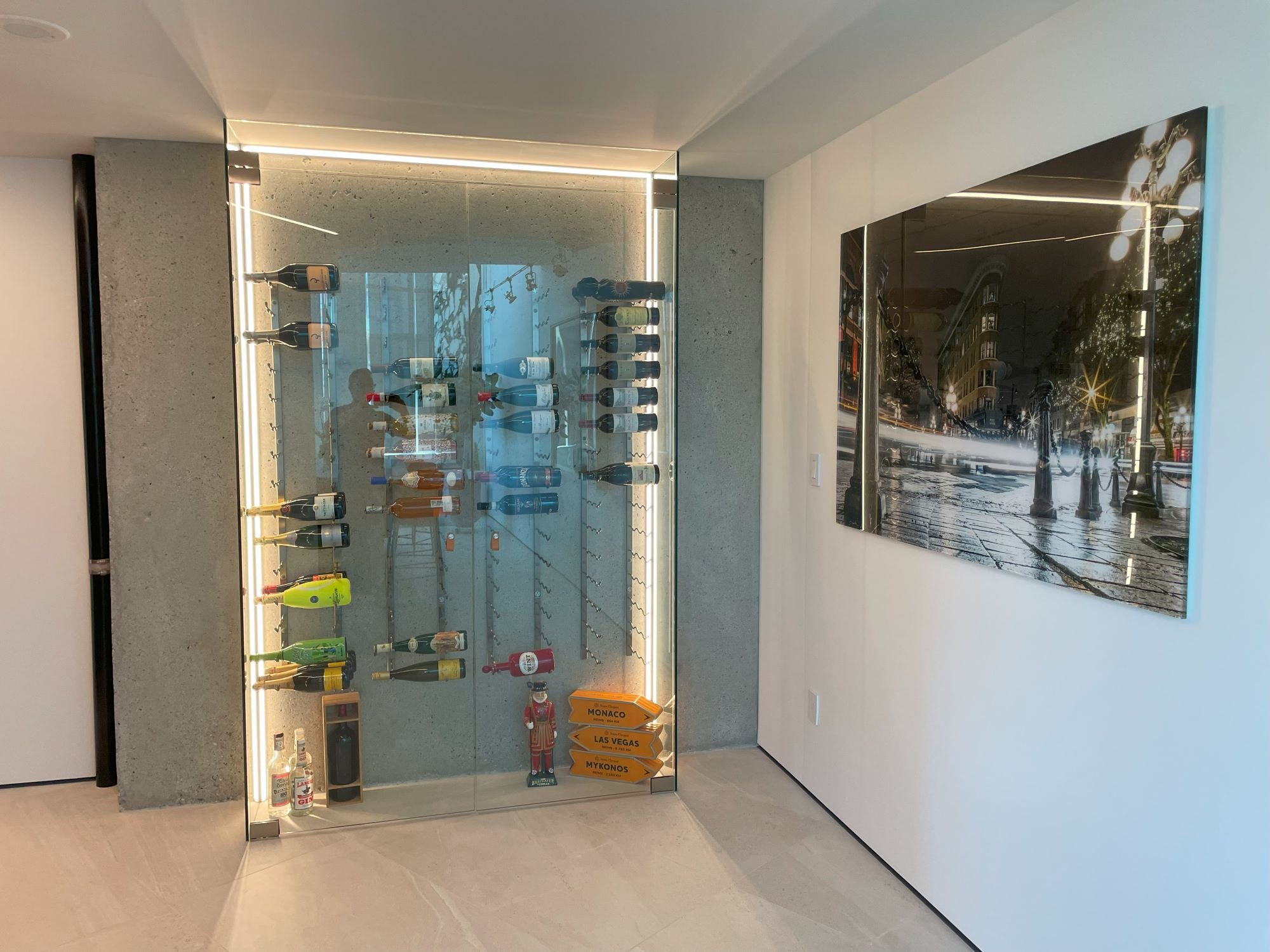 We exposed the concrete to provide the perfect backdrop for this wine wall