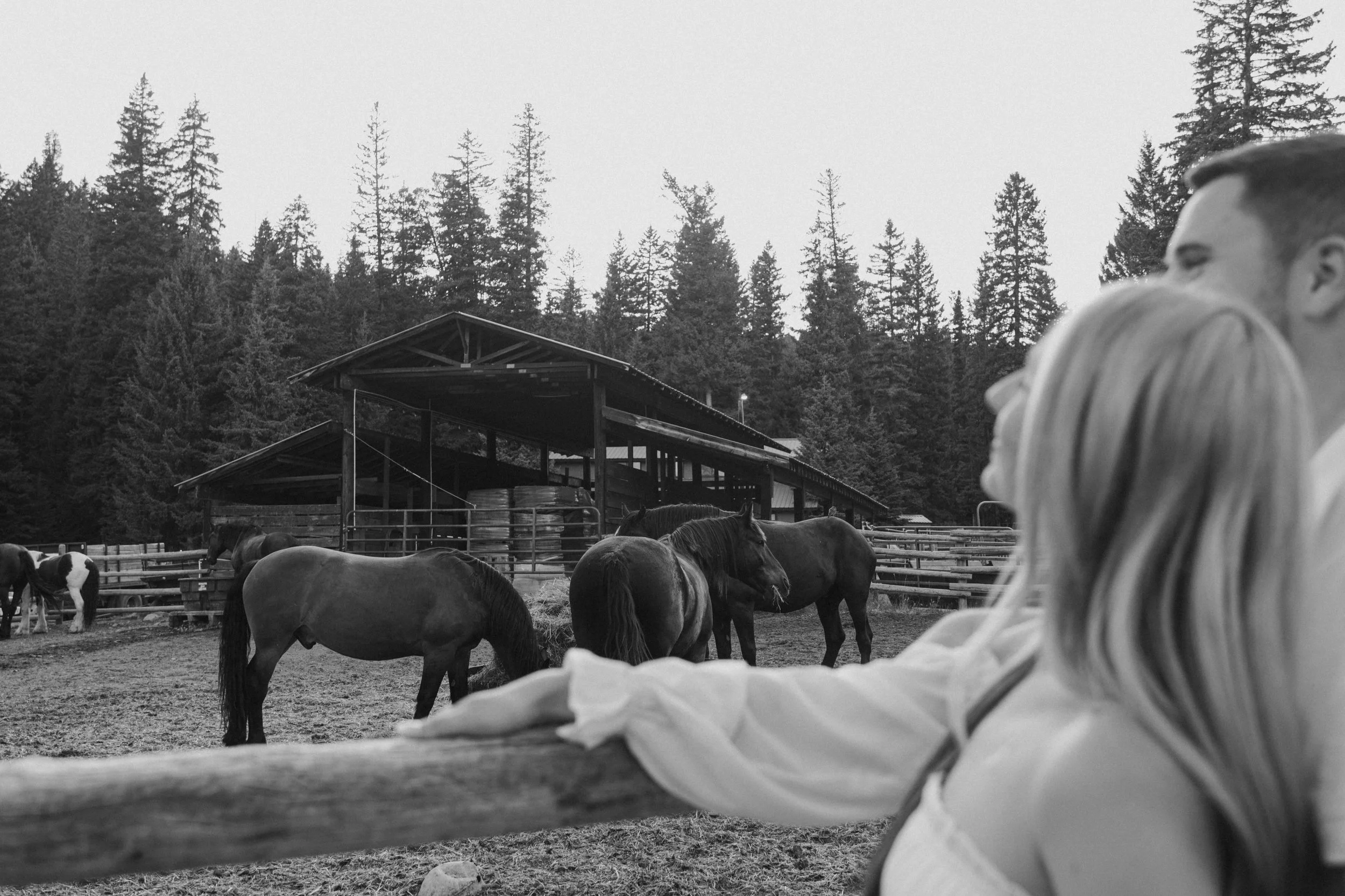 Candid moment between an engaged couple exploring Lone Mountain Ranch during their Montana engagement photos.