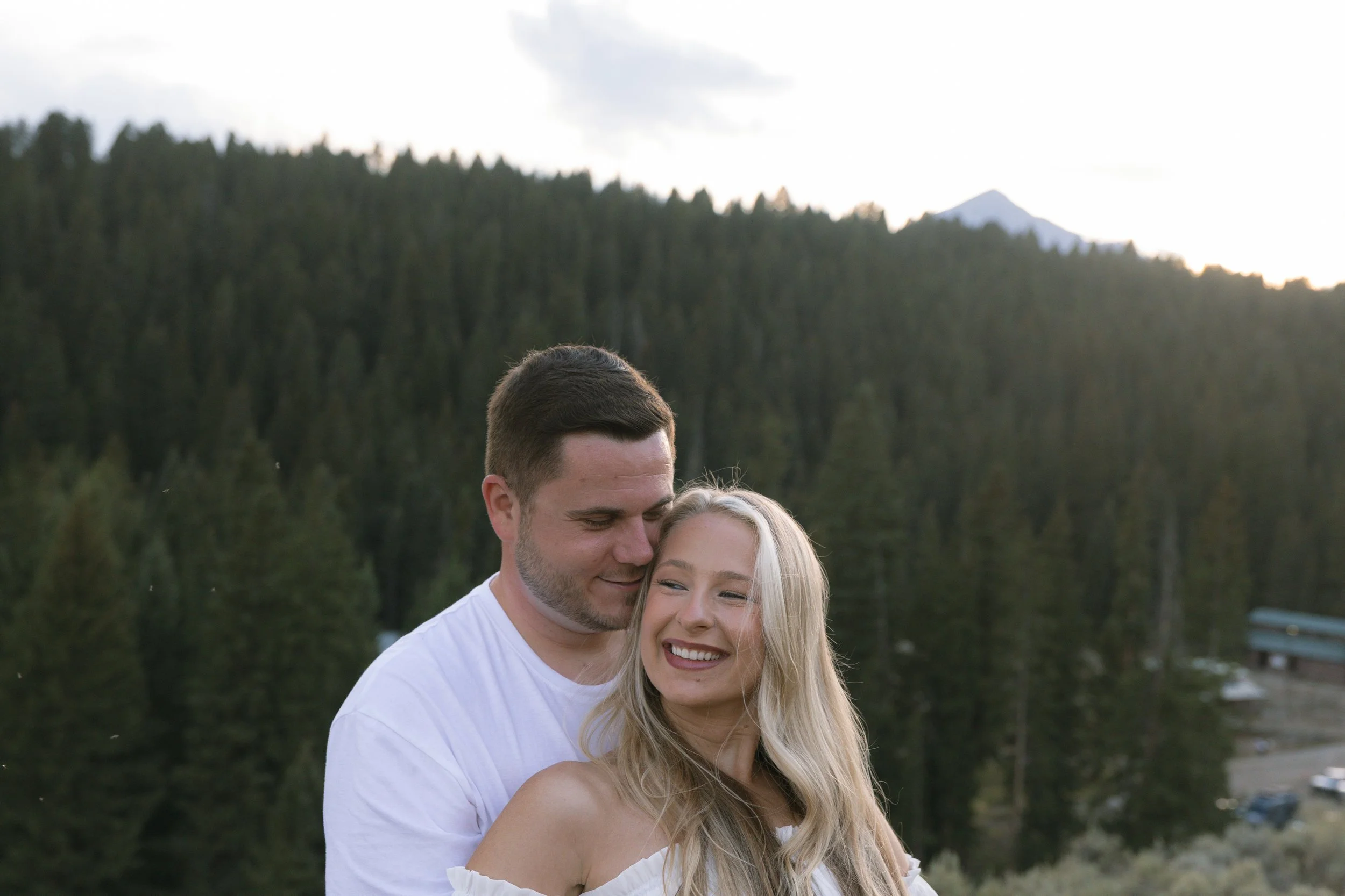 Romantic portrait of a couple surrounded by the mountains and natural scenery at Lone Mountain Ranch.