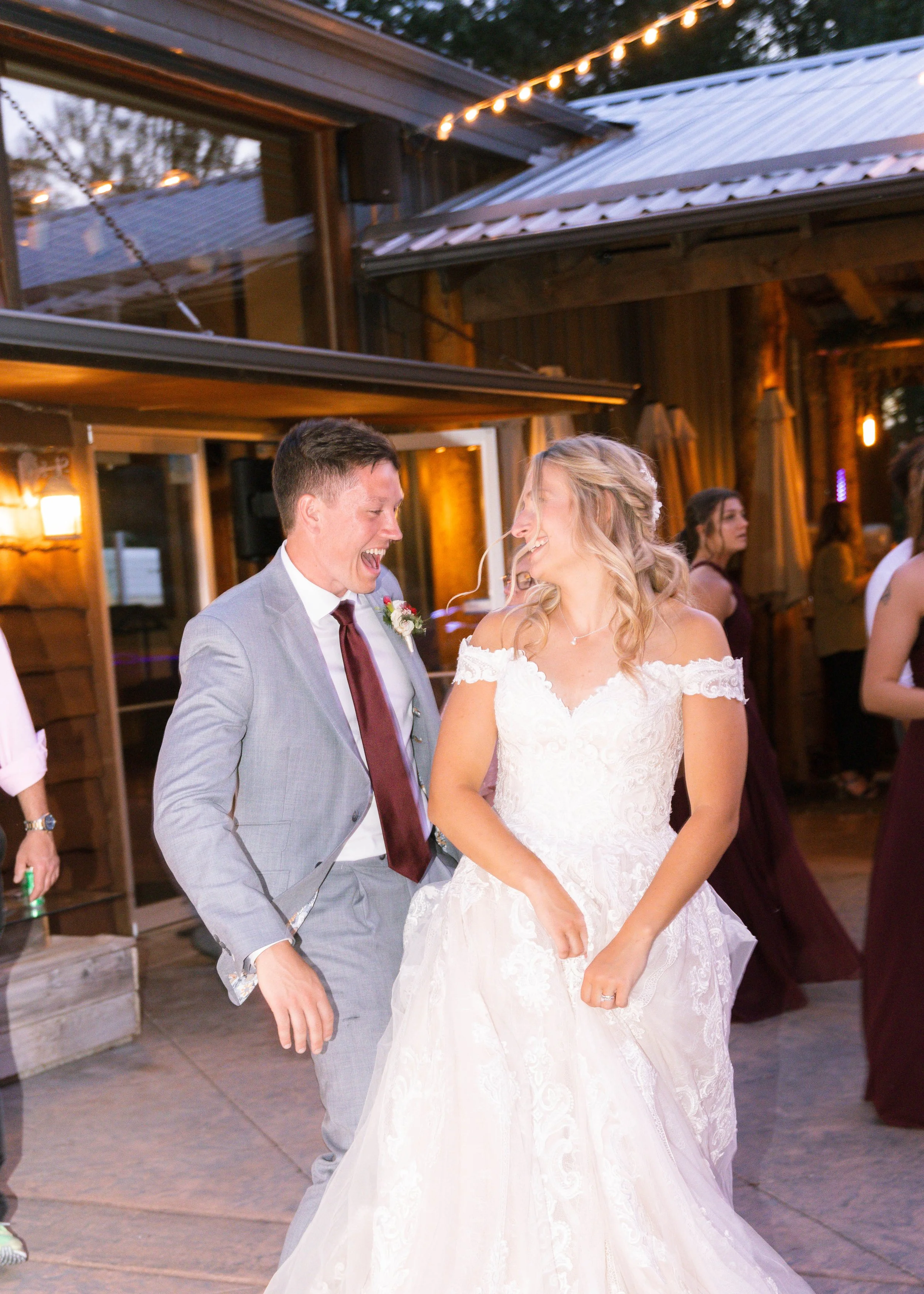 Bride and groom dance together at Tj Rockin Ranch in Bozeman Montana