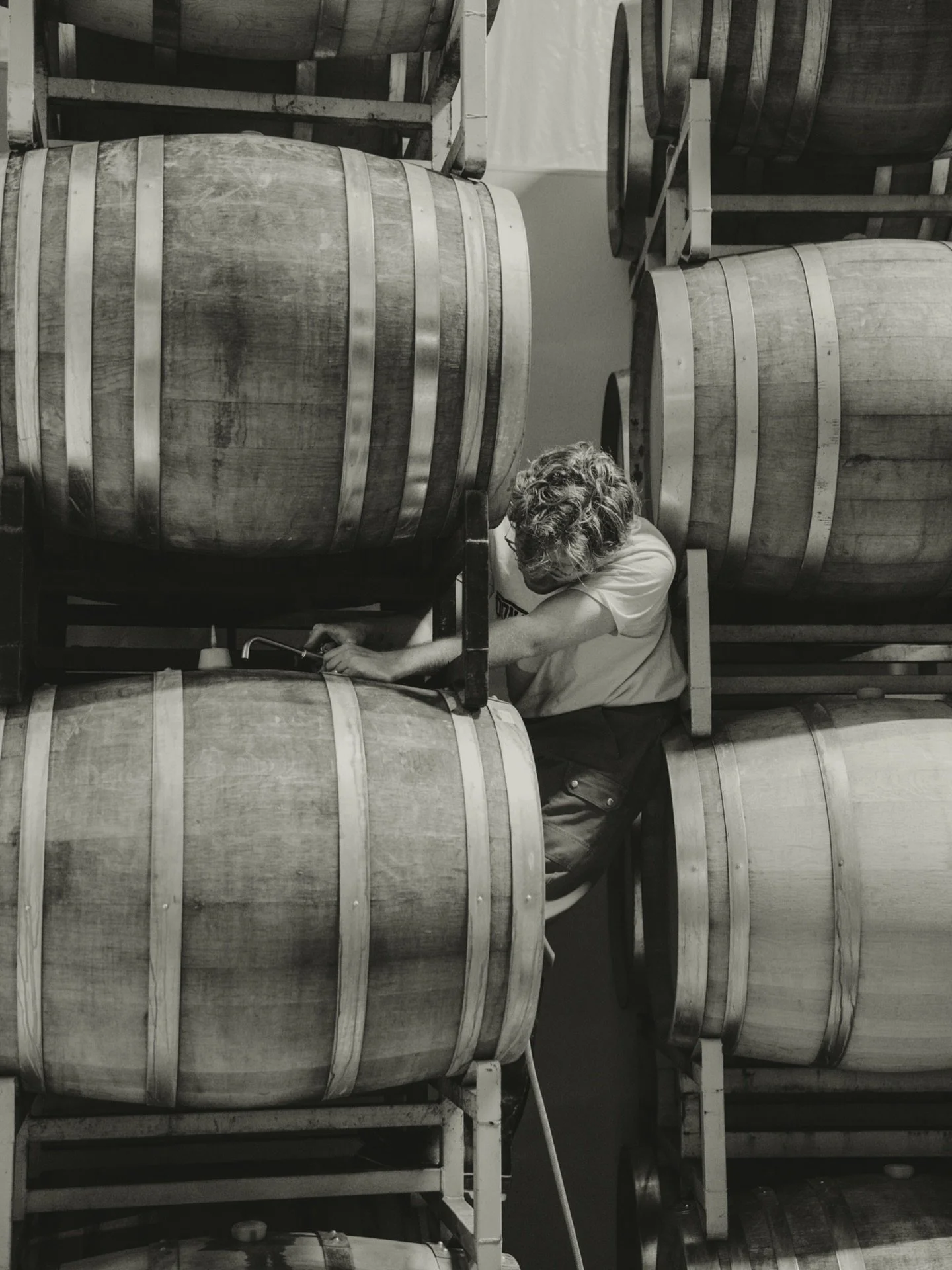 Owen topping barrels, one by one. Listening. Adjusting. Making sure each wine has exactly what it needs to keep becoming itself. This is the quiet work that fills the spaces between harvests. No fanfare. Just patience, presence, and trust in time.

T