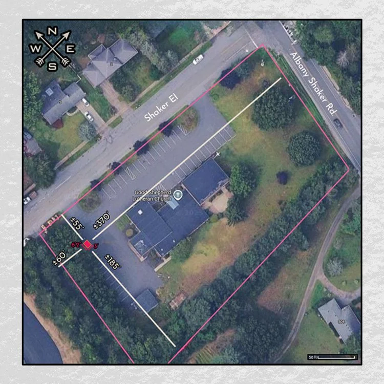 Aerial view of a property surrounded by trees with a church, parking lot, and streets labeled Shaker El and Albany Shaker Rd.