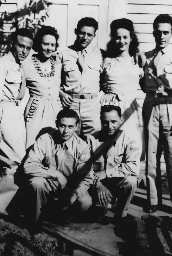 Black and white photo of the Messina sisters, Dorothy and Mary, with Jackson Barracks POW including Antonio Pezzana. Photo courtesy of Linda DiMarzio Massicot.