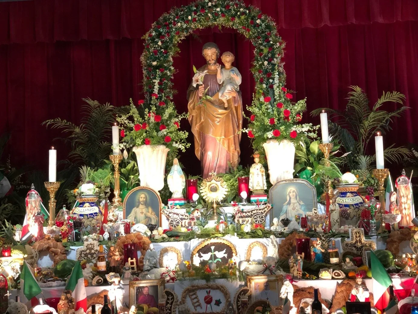 St. Joseph Altar with food, candles, and offerings.