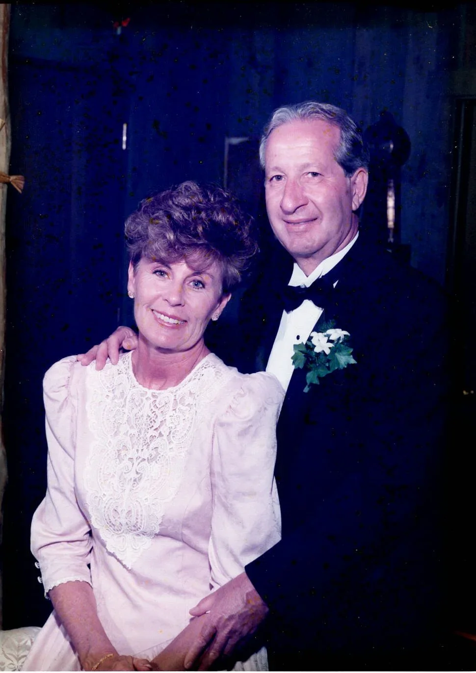 Fred and Fran Speranza – A woman in a light pink dress and man in a suit with a bow tie smiling and looking at the camera.