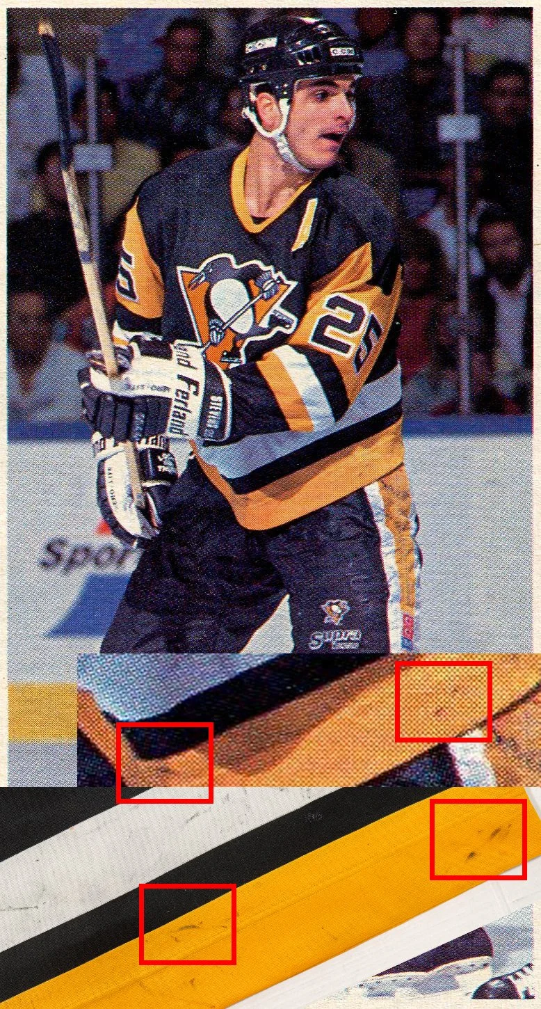 The same stick marks appear in this image, as well as an additional mark.