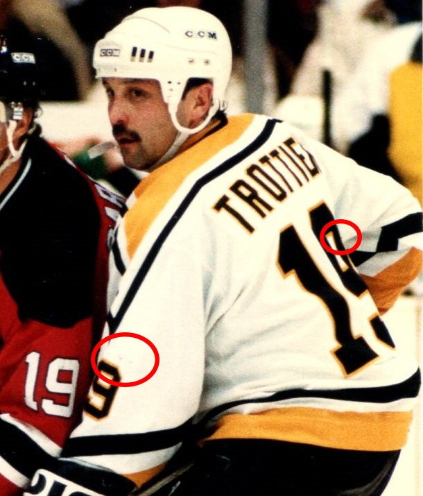 The same mark can barely be seen in this photo vs the Devils on Dec 2nd, as well as some loose threads on the back 9 which are also present on the jersey.