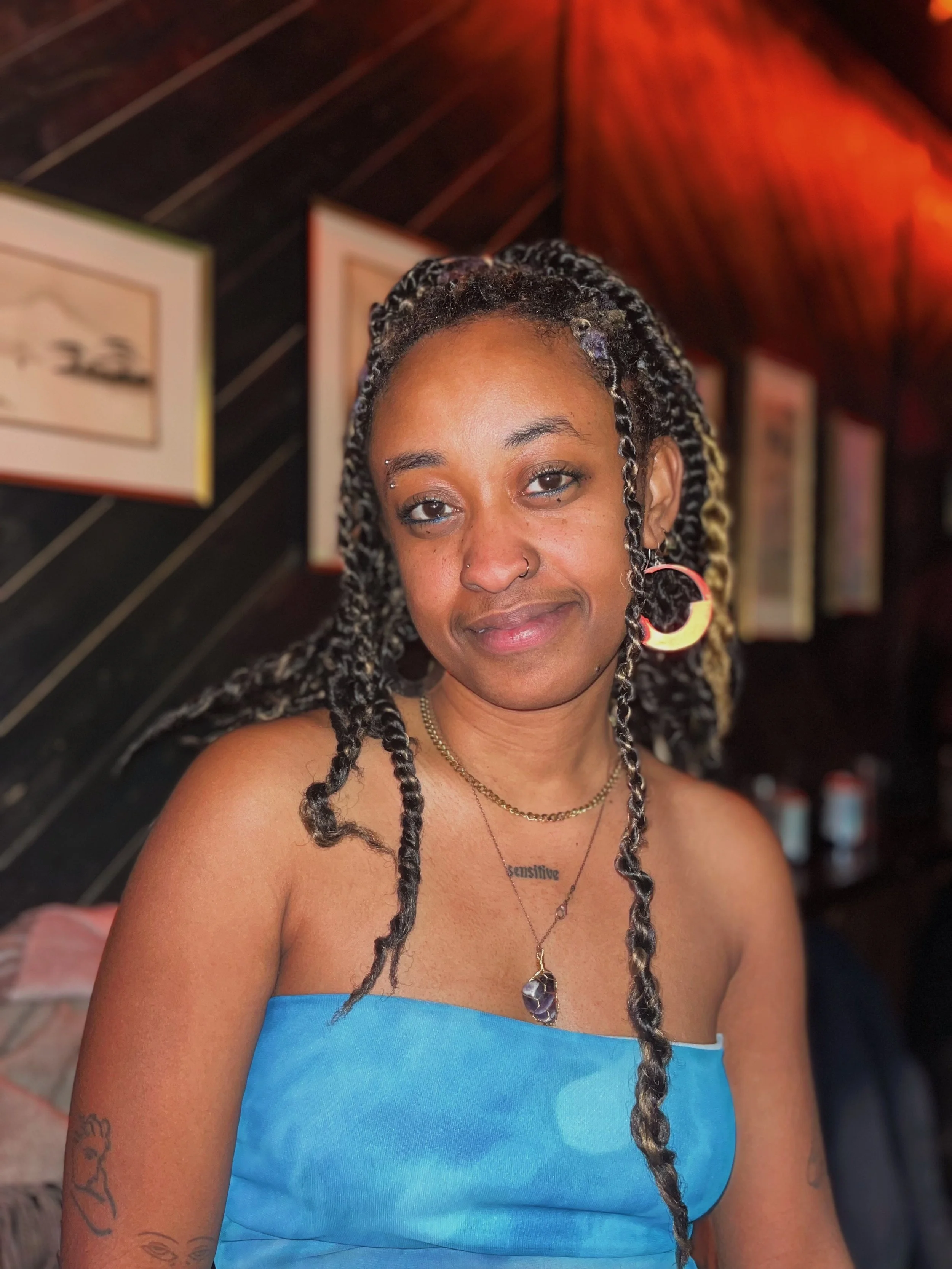 Brooklyn Queer Pool member Jacke Colquitt gives the camera a knowing look at Abe's Pagoda Bar.