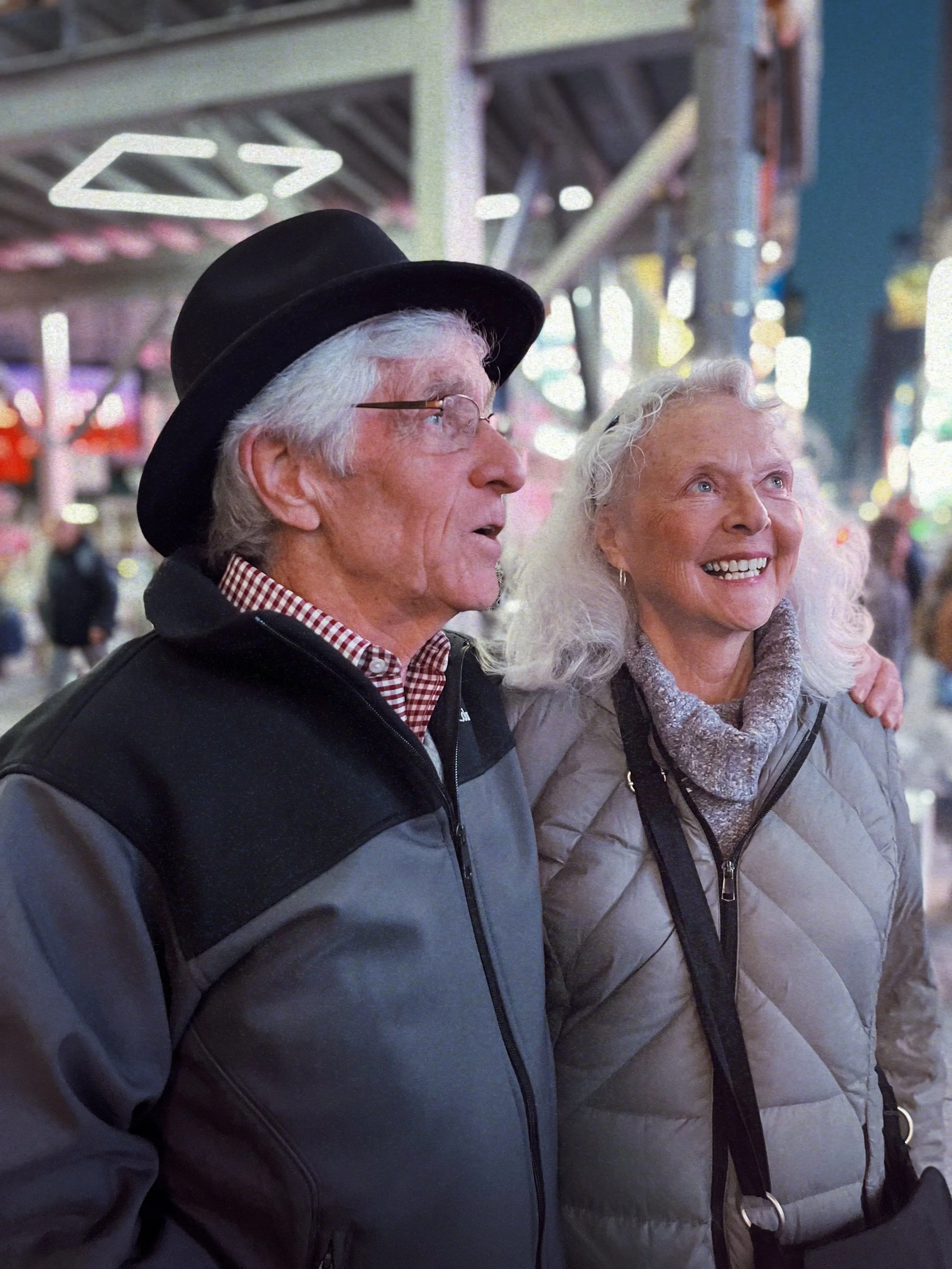 South Carolina attorney Jack Lawrence sees Times Square for the first time, accompanied by his wife, Kay. A halo from the city flourishes above him.