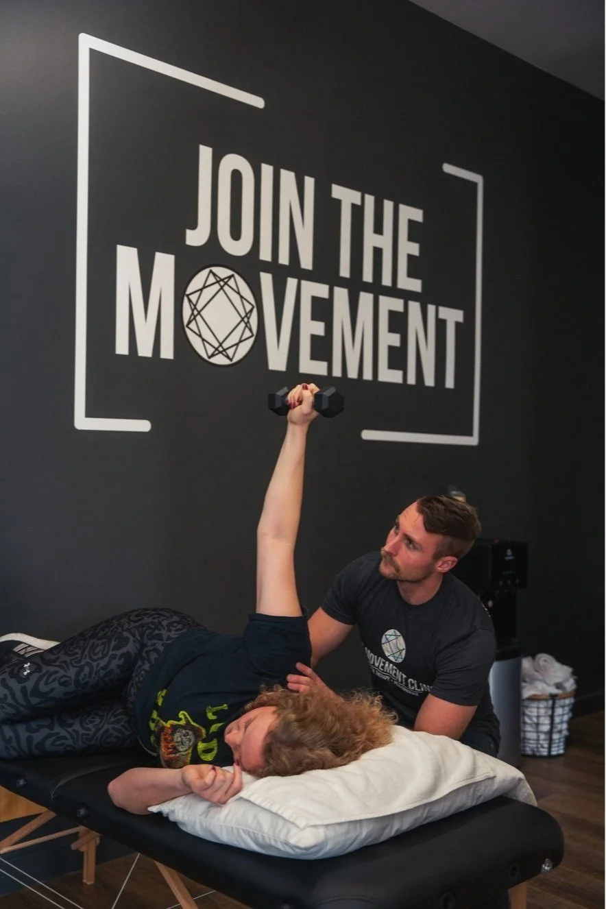 Doctor of Physical Therapy performing hands-on manual therapy treatment for shoulder mobility at Pasadena clinic