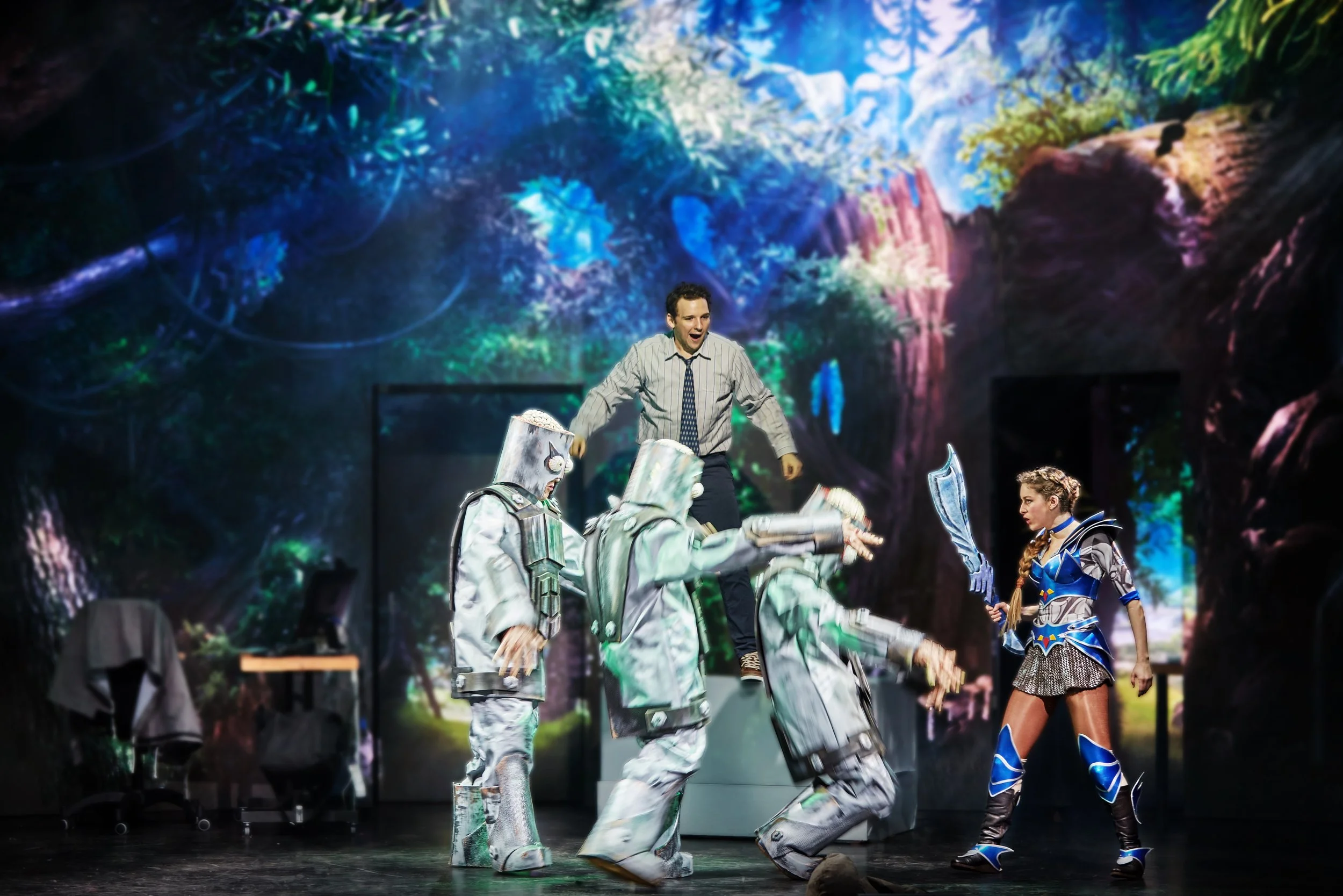 Legendale musical image, Zelayna defeats the zombie robots (zombots) with a sword while Andy watches in awe