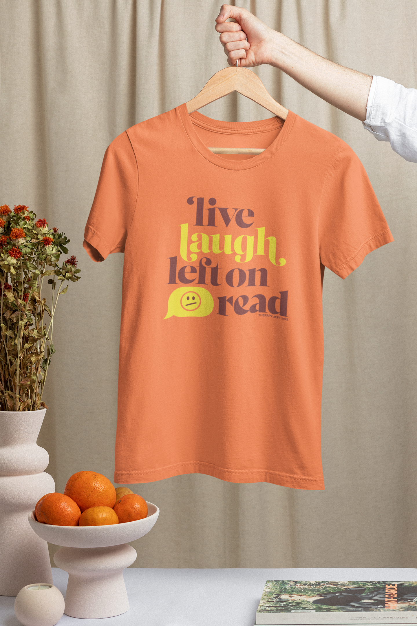 mockup-of-a-man-holding-a-hanger-with-a-bella-canvas-t-shirt-featuring-ceramic-pottery-m23502.png