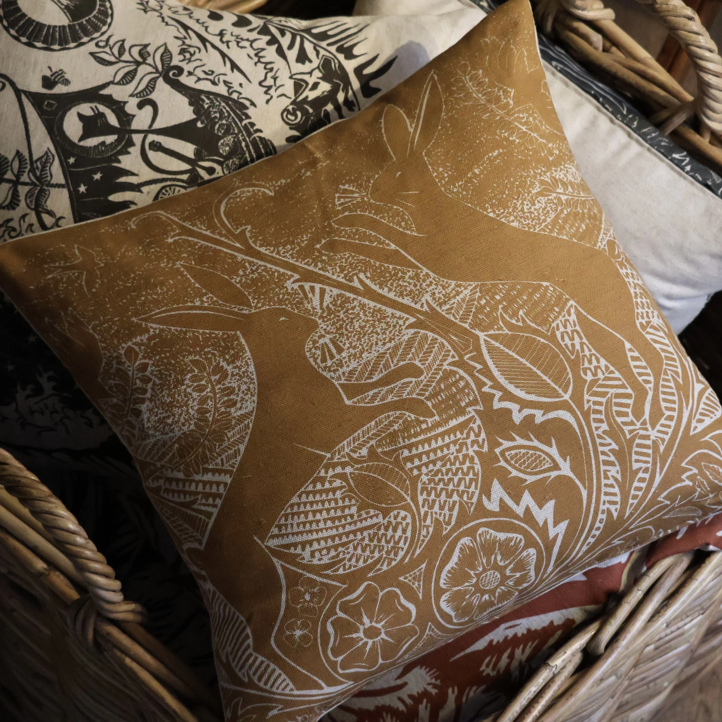 The Boxing Match (ochre) - Cushion based on an original Linocut design