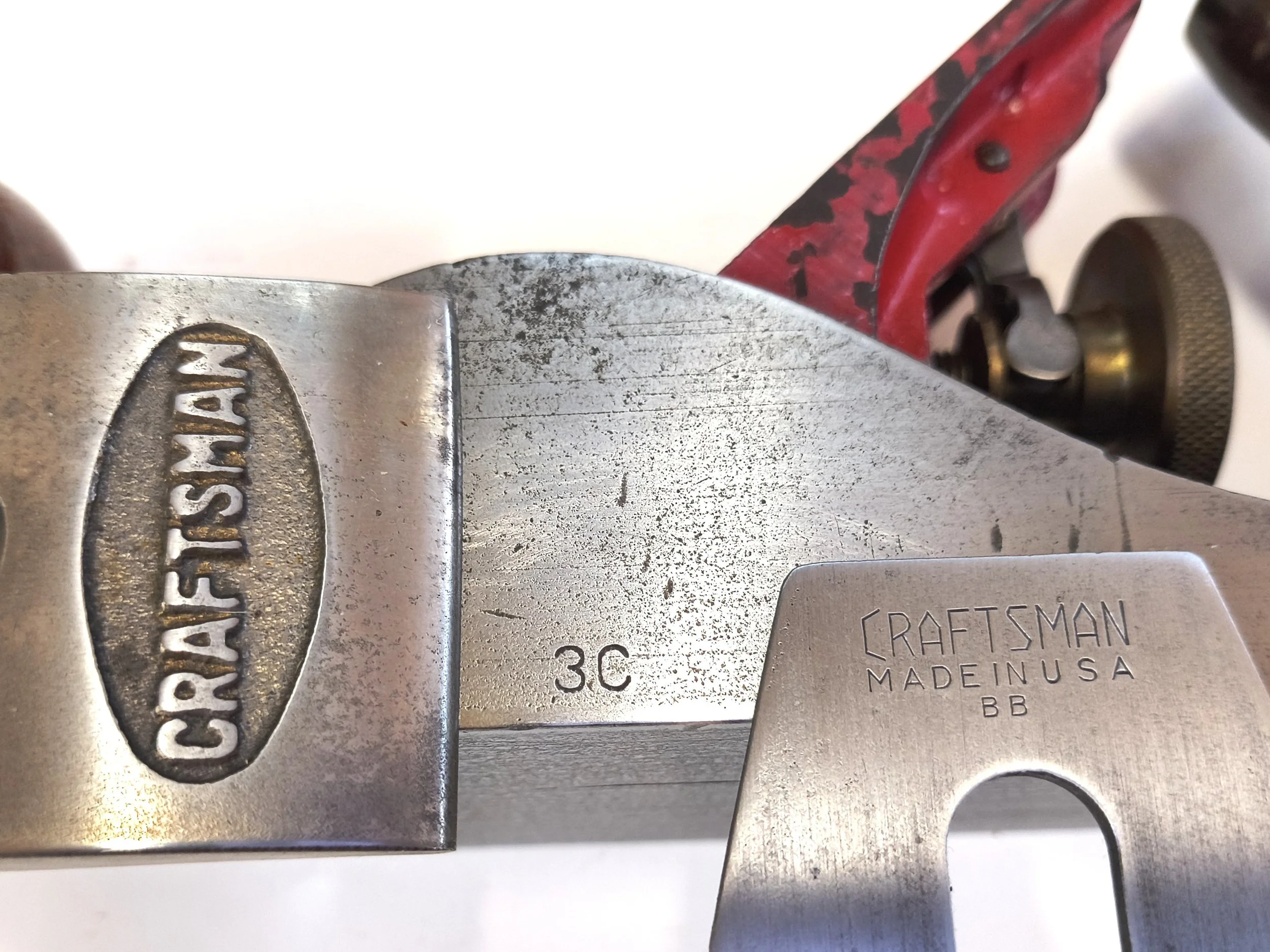 The segmented Iron has the OEM, but the cheek does not have the OEM. There is still a little gold between the letters.