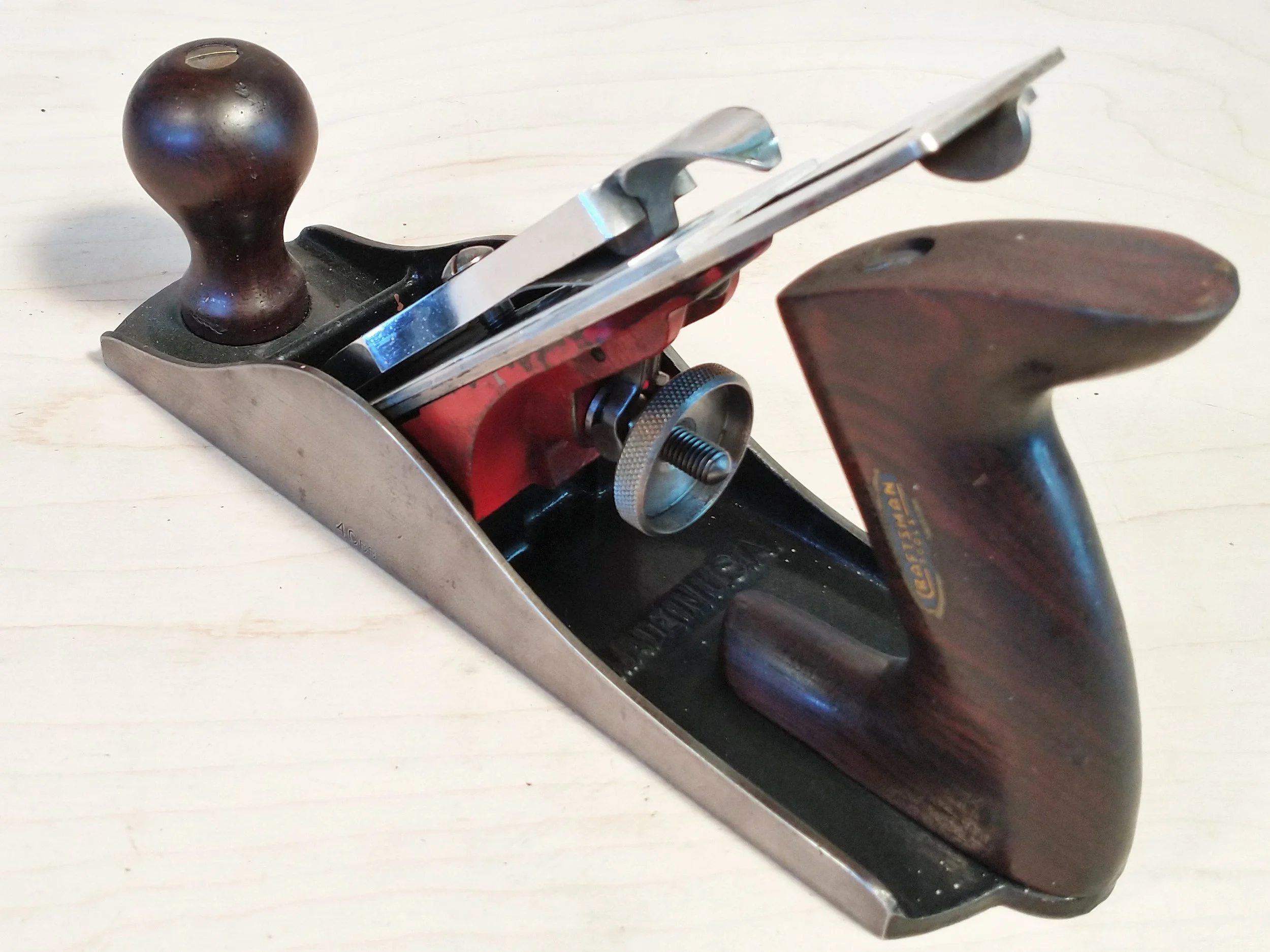 Rosewood knob and tote and a nickel depth adjusting nut.