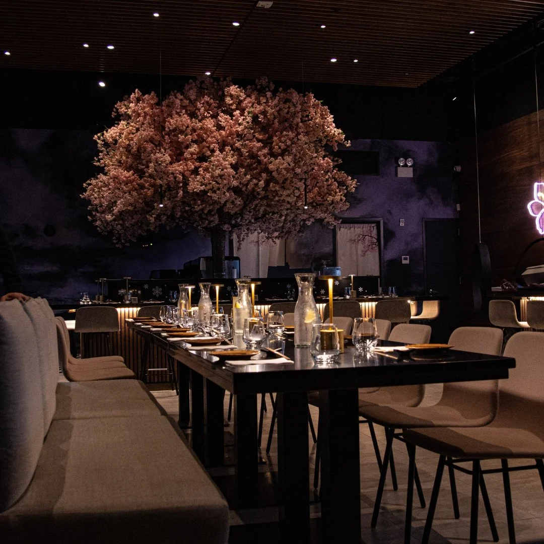 Kaizen restaurant with cherry blossom tree at the sushi counter and dining tables