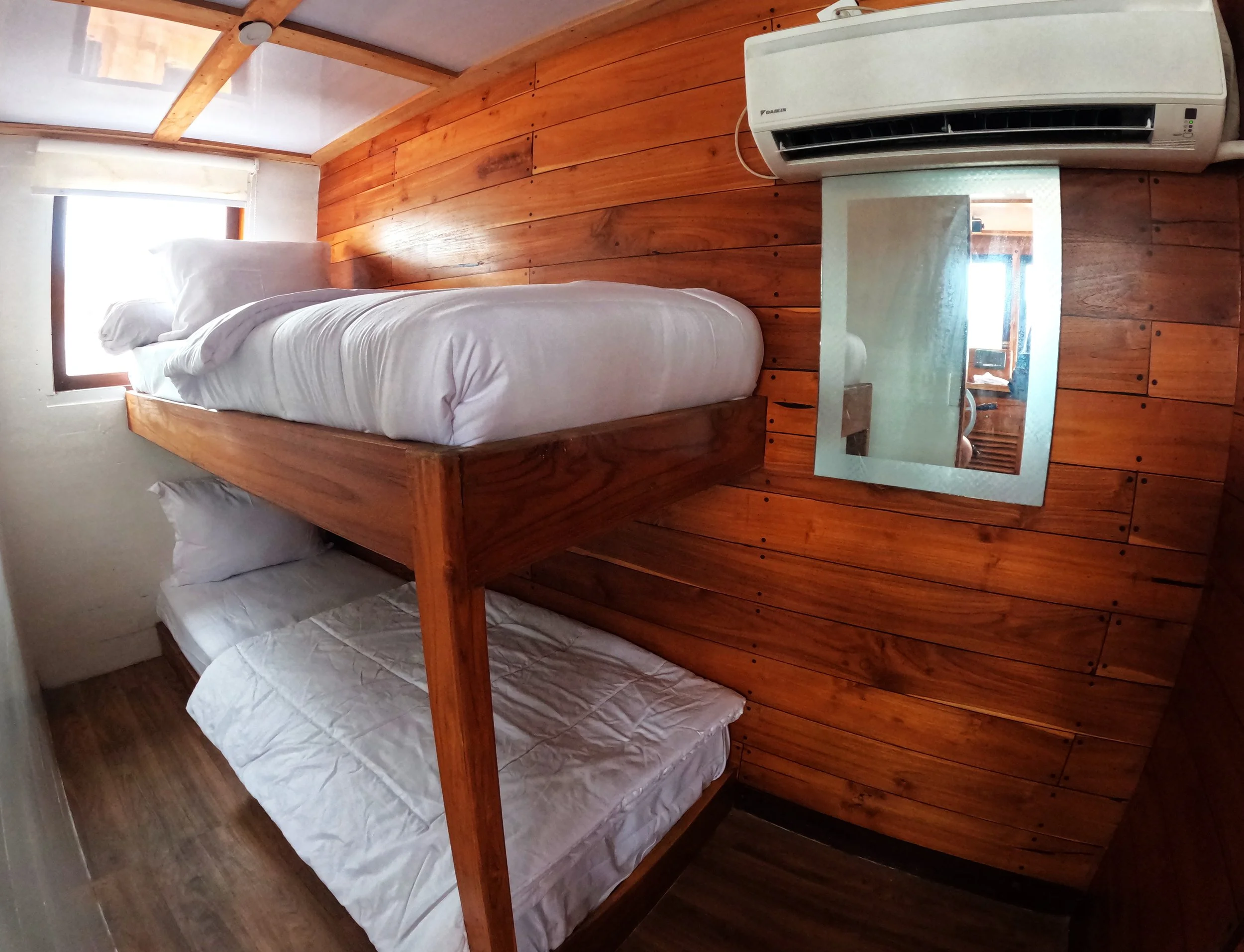 Shared cabin sleeping area during premium Komodo sailing open trip liveaboard