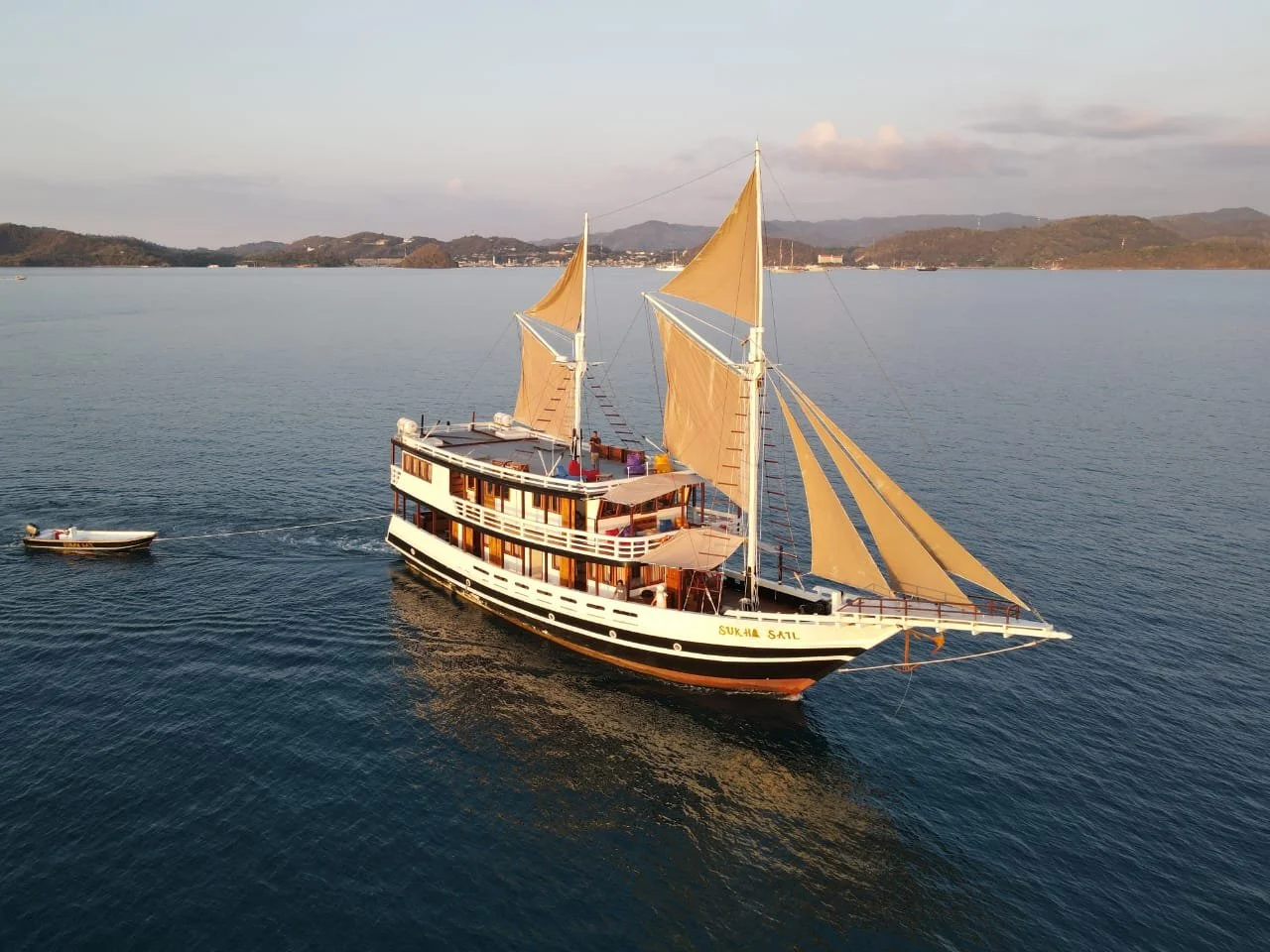 Signature phinisi sailing boat during curated Komodo National Park liveaboard journey and sailing trip