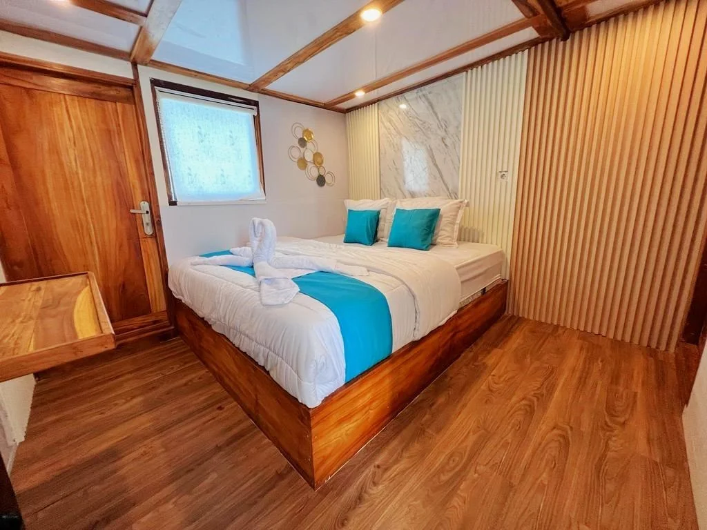 Queen bed cabin interior on premium Lombok to Komodo sailing trip liveaboard