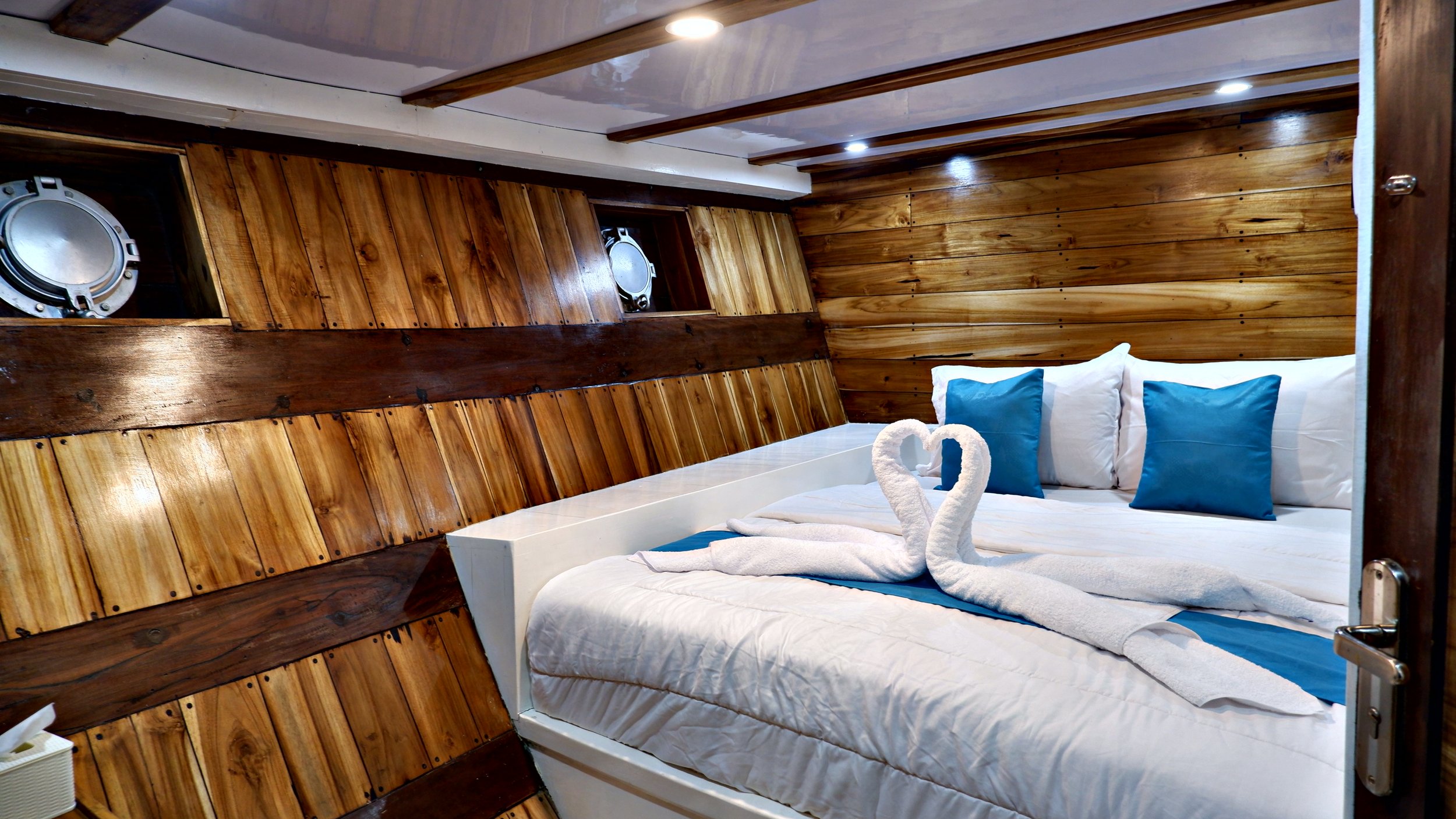 Lower deck private cabin with air conditioning onboard premium Komodo National Park sailing trip