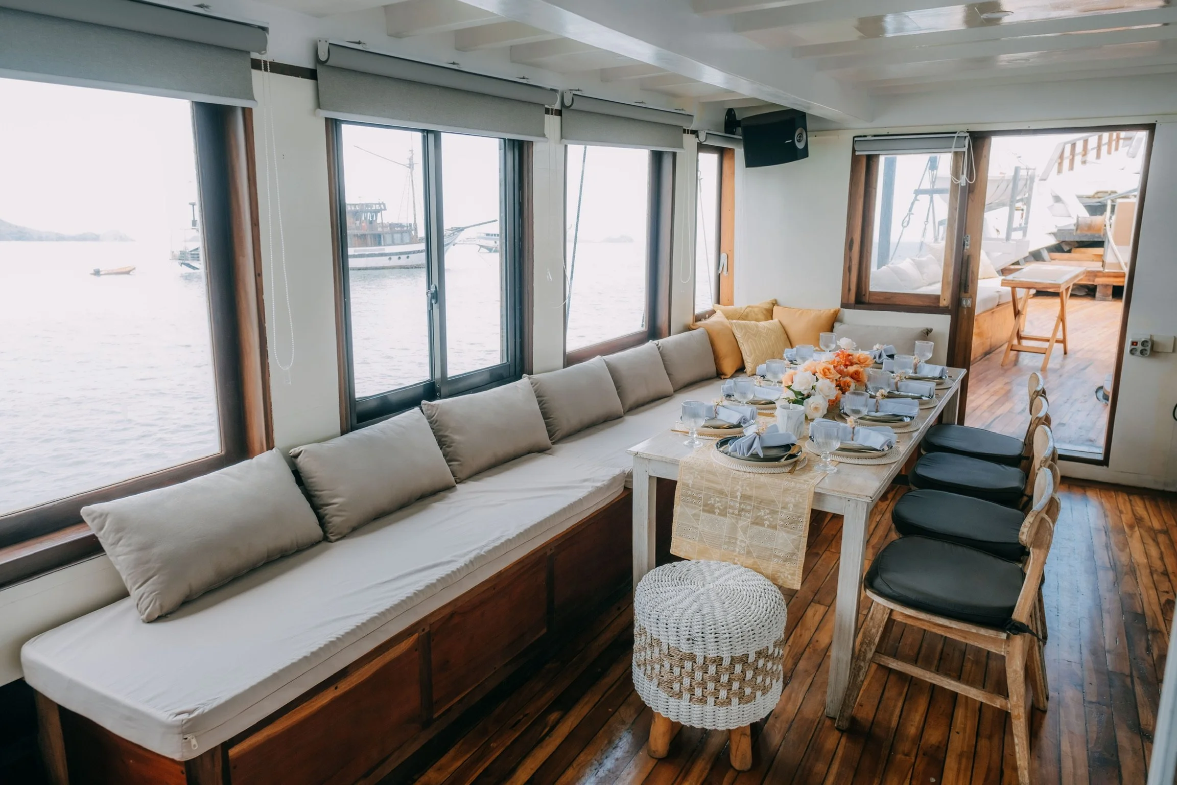 Open-air dining area onboard signature Komodo sailing liveaboard during Lombok to Labuan Bajo trip
