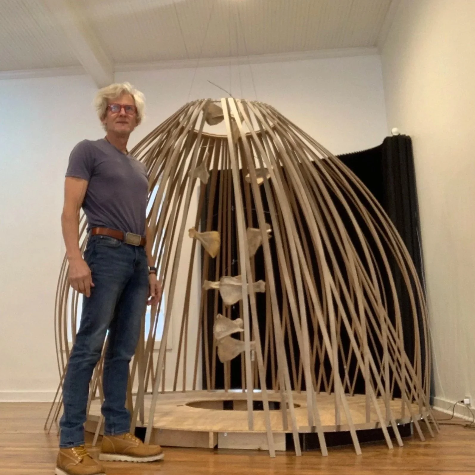 "Sawubona" — I see you. - 2022-2023
Bones inlaid with sterling silver words, each carved on both sides with the paired truths of being human. The mobile hangs within a wooden structure ten feet tall, slowly turning. It is an acknowledgment — of you, 