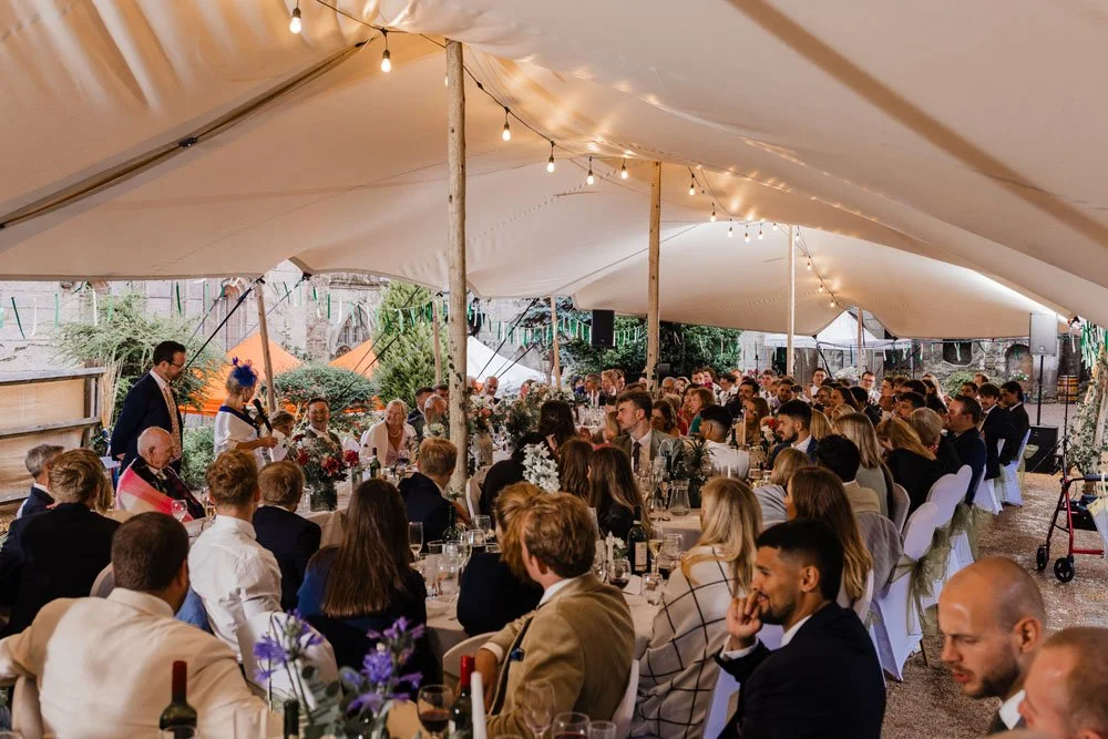 Guests sat listening to speeches in the marquee at Guys Cliffe House