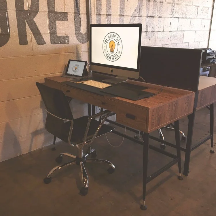 A dedicated desk left set up at Union Hall Workspace in Amarillo
