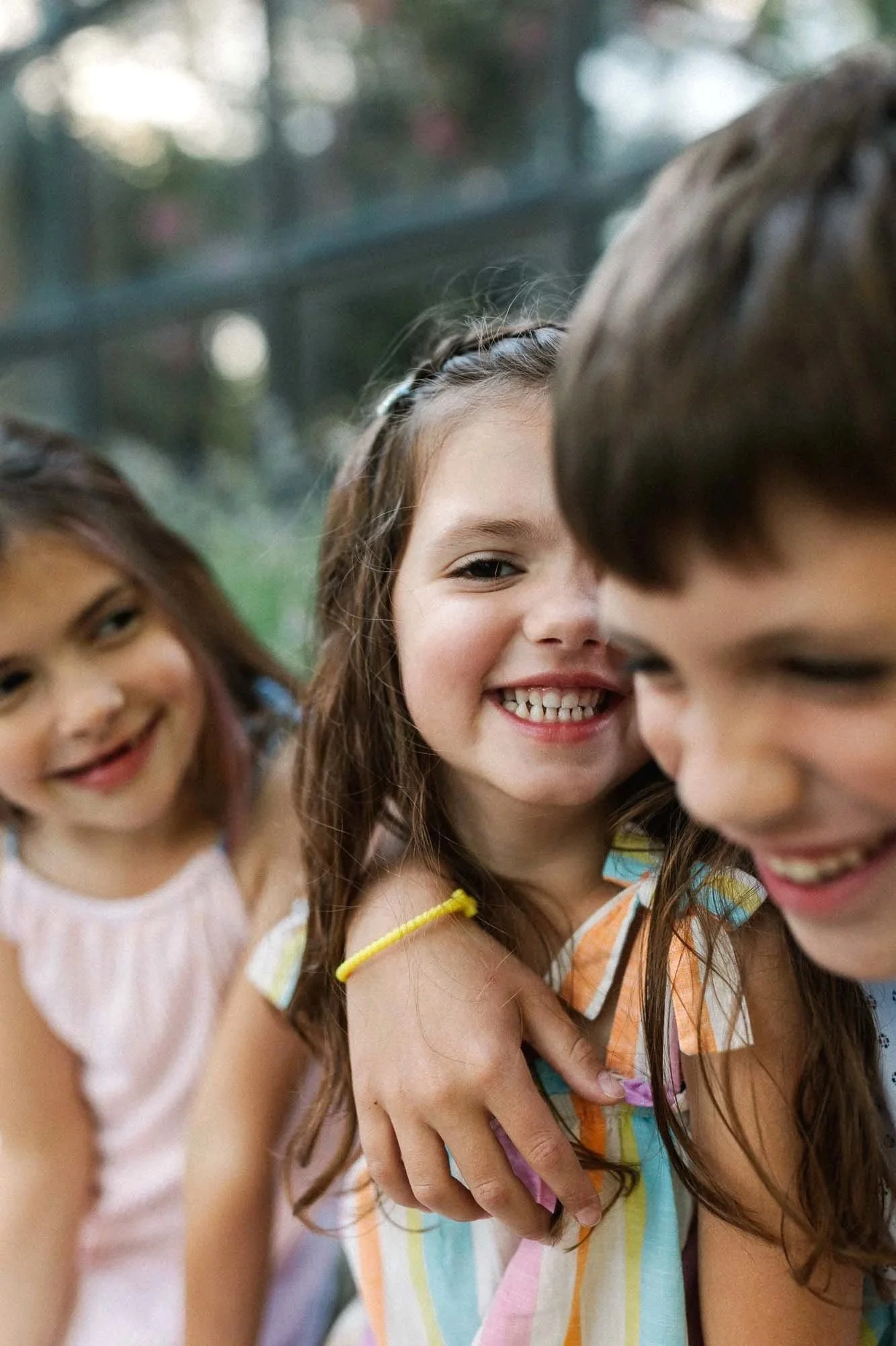 three siblings laughing family photos in downtown bexley ohio